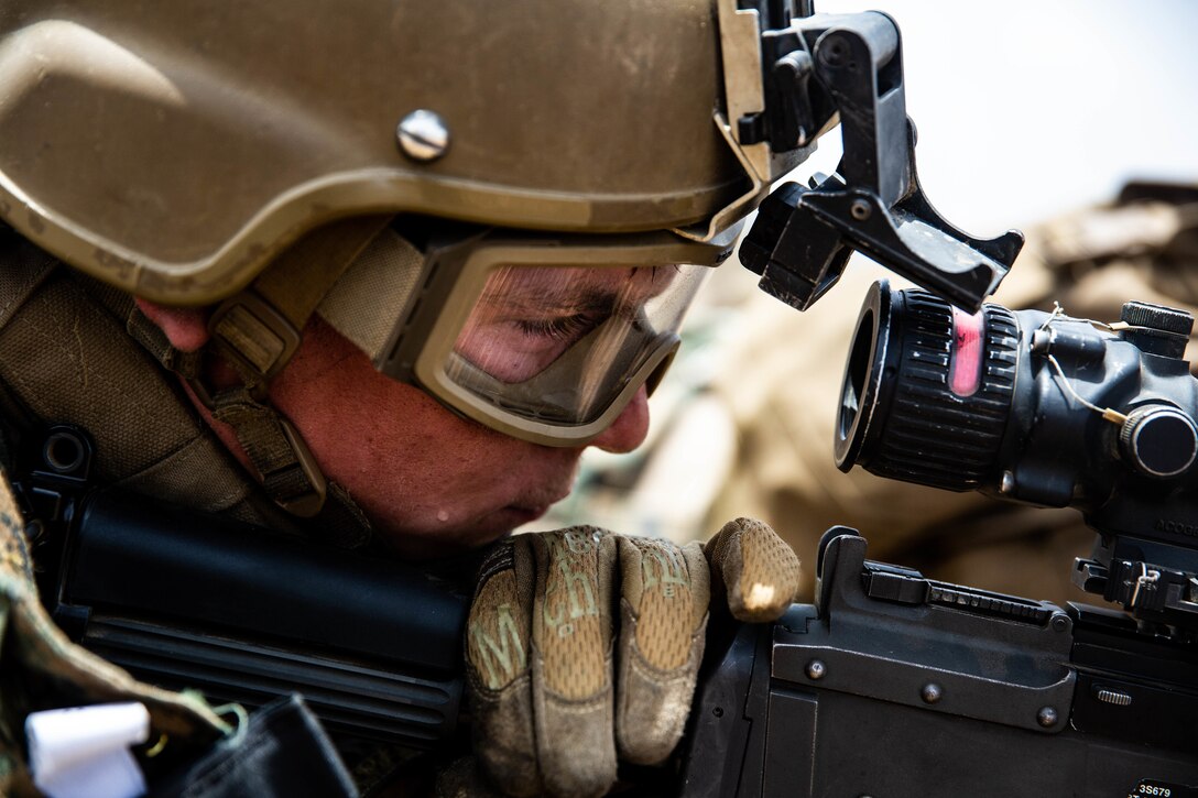 A U.S. Marine with Special Purpose Marine Air-Ground Task Force-Crisis Response-Africa 19.2, Marine Forces Europe and Africa, prepares to fire an M240B machine gun during quick-reaction force training in Thiés, Senegal, Aug. 5, 2019. The rehearsal increased the Marines’ ability to conduct link-up procedures, on scene and in-route trauma stabilization, and offensive and defensive operations. SPMAGTF-CR-AF is deployed to conduct crisis-response and theater-security operations in Africa and promote regional stability by conducting military-to-military training exercises throughout Europe and Africa. (U.S. Marine Corps photo by Cpl. Margaret Gale)
