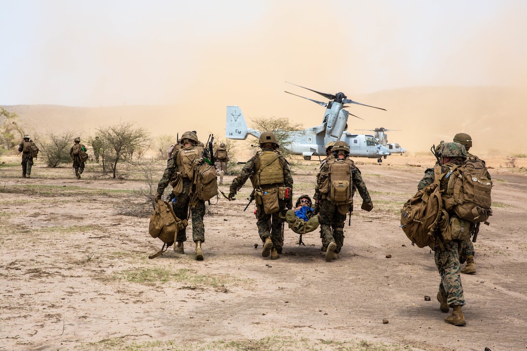 U.S. Marines with Special Purpose Marine Air-Ground Task Force-Crisis Response-Africa 19.2, Marine Forces Europe and Africa, extract a simulated casualty during quick-reaction force training in Thiés, Senegal, Aug. 5, 2019. The rehearsal increased the Marines’ ability to conduct link-up procedures, on scene and in-route trauma stabilization, and offensive and defensive operations. SPMAGTF-CR-AF is deployed to conduct crisis-response and theater-security operations in Africa and promote regional stability by conducting military-to-military training exercises throughout Europe and Africa. (U.S. Marine Corps photo by Cpl. Margaret Gale)