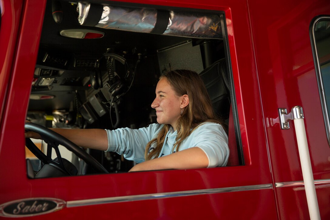 A member of the Boys and Girls Club Miramar sits in the driver’s seat of a fire truck at Marine Corps Air Station Miramar, Calif., Aug. 12. The Boys and Girls Club Miramar youths visited MCAS Miramar Station 61 to understand the importance of firefighting. (Marine Corps photo by Lance Cpl. Cheng Chang)