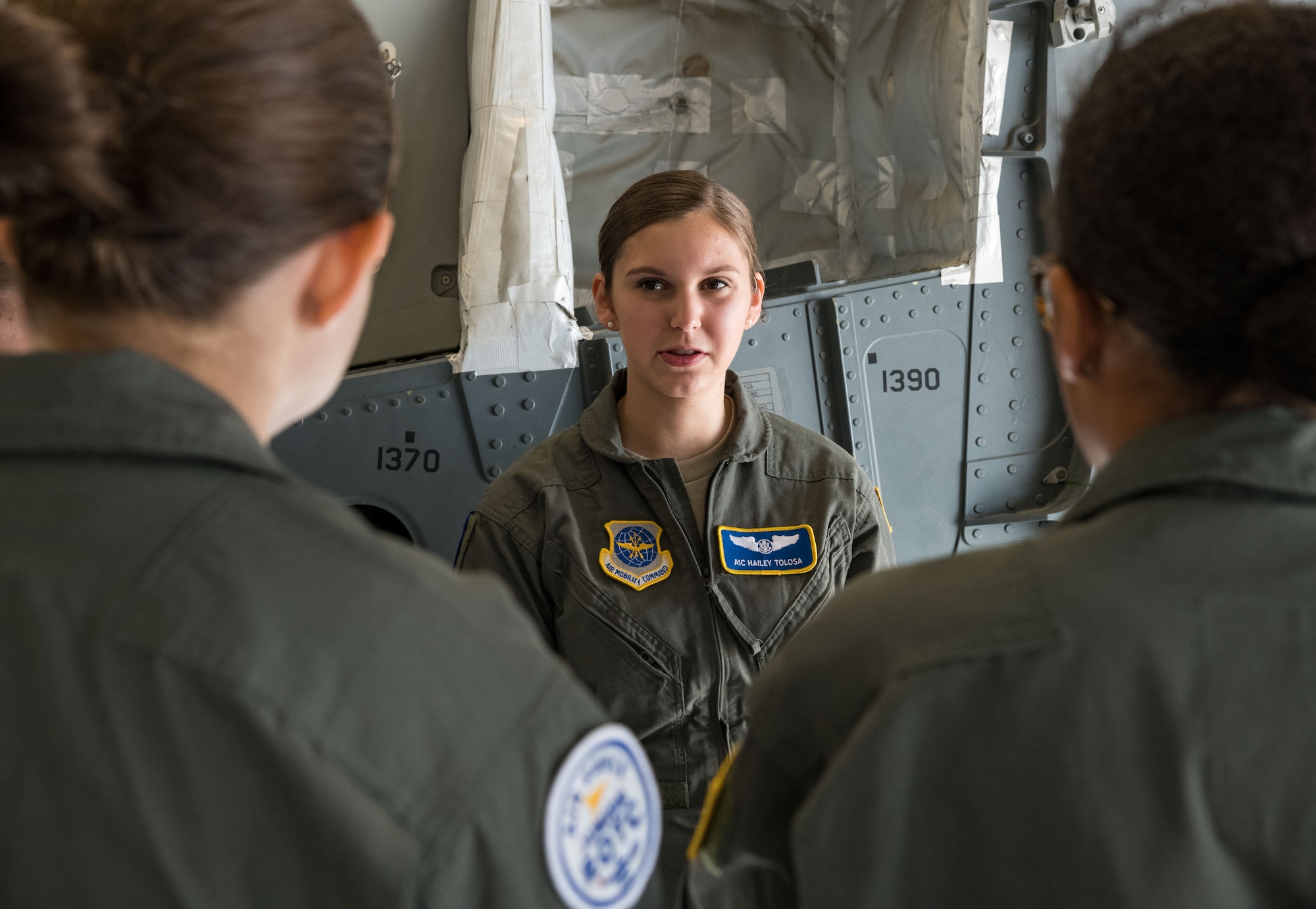 Airman 1st Class Hailey Tolosa, 3rd Airlift Squadron C-17A Globemaster III loadmaster, answers questions from Air Force Junior Reserve Officers’ Training Corps cadets about her profession in the Air Force July 23, 2019, at Dover Air Force Base, Del. Cadets who attended the AFJROTC Summer Flight Academy at Delaware State University in Dover, met with Tolosa and other C-17 aircrew members during their half-day tour of the base. (U.S. Air Force photo by Roland Balik)