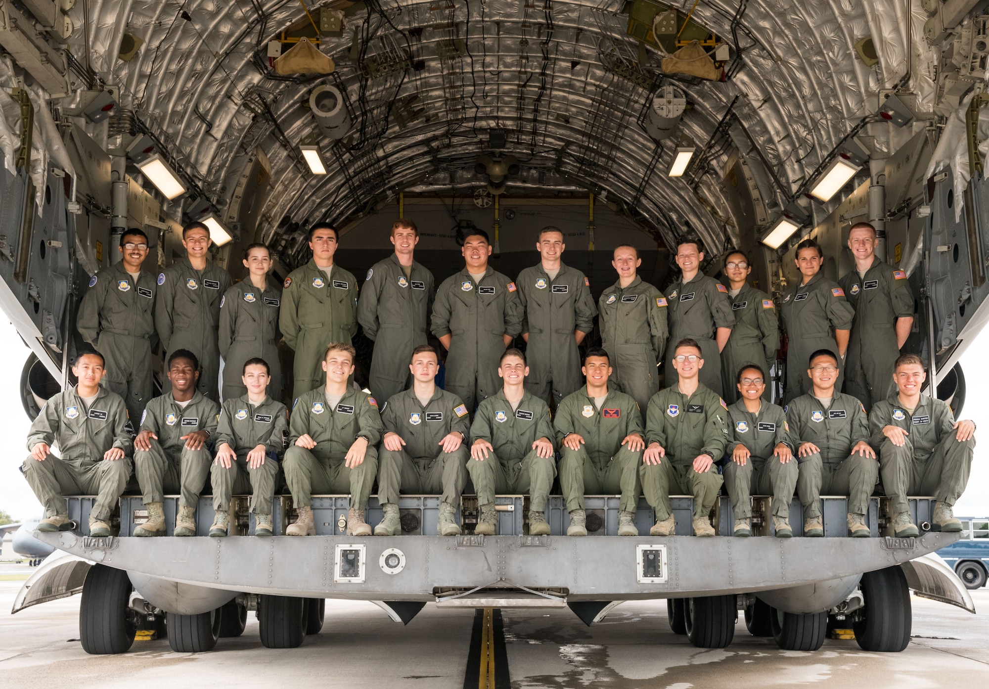 Air Force Junior Reserve Officers’ Training Corps cadets pose for a photo on the cargo ramp of a C-17A Globemaster III July 23, 2019, at Dover Air Force Base, Del. Cadets who attended the eight-week AFJROTC Summer Flight Academy held at Delaware State University in Dover, toured aviation-related facilities and aircraft. (U.S. Air Force photo by Roland Balik)
