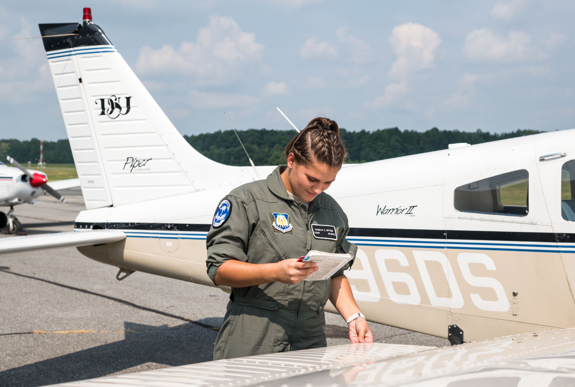 Air Force Junior Reserve Officers’ Training Corps cadet Madelyn Spitzer, checks the right wing on a Piper Warrior II during the preflight of the aircraft Aug. 6, 2019, at Delaware Airpark in Cheswold, Del. Spitzer and Mohammad Ahmed, Delaware State University certified flight instructor, flew around the airpark and practiced skills learned during the eight-week AFJROTC Summer Flight Academy held at DSU in Dover. Spitzer is a cadet with AFJROTC Detachment SC-951, Clover High School, Clover, S.C. (U.S. Air Force photo by Roland Balik)