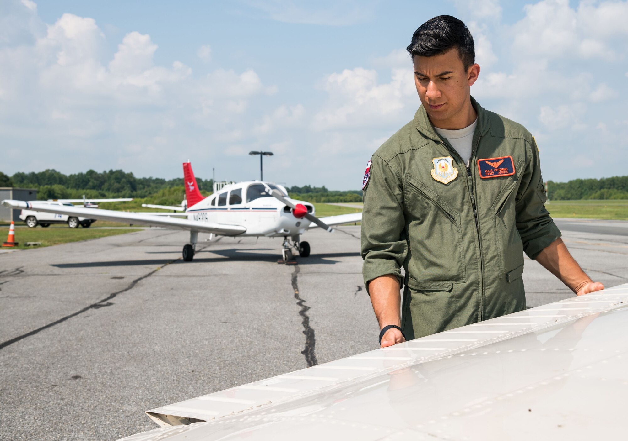 Air Force Junior Reserve Officers’ Training Corps cadet Isaac Victorino, checks the left wing on a Piper Warrior II during the preflight of the aircraft Aug. 6, 2019, at Delaware Airpark in Cheswold, Del. Victorino and Mohammad Ahmed, Delaware State University certified flight instructor, flew around the airpark and practiced skills learned during the eight-week AFJROTC Summer Flight Academy held at DSU in Dover. Victorino is a cadet with AFROTC Detachment 842, University of Texas at San Antonio. (U.S. Air Force photo by Roland Balik)