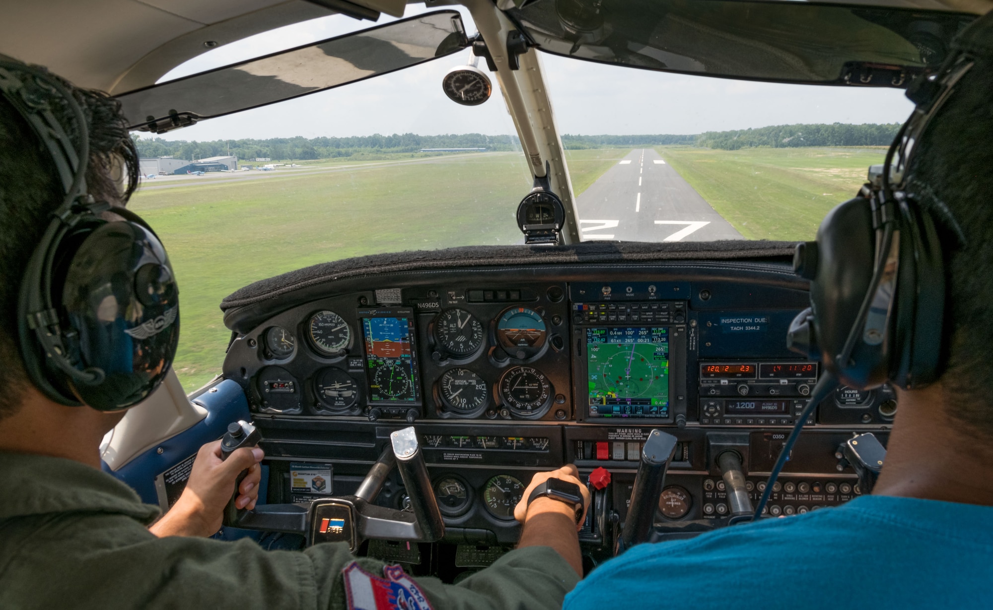 Mohammad Ahmed, Delaware State University certified flight instructor, points out flight instrumentation to Air Force Junior Reserve Officers’ Training Corps cadet Isaac Victorino, as he flies the Piper Warrior II in for a touch and go landing Aug. 6, 2019, at Delaware Airpark in Cheswold, Del. Under the guidance of Ahmed, Victorino flew around the airpark and practiced skills he learned during the eight-week AF JROTC Summer Flight Academy held at DSU in Dover. Victorino is a cadet with AFROTC Detachment 842, University of Texas at San Antonio. (U.S. Air Force photo by Roland Balik)