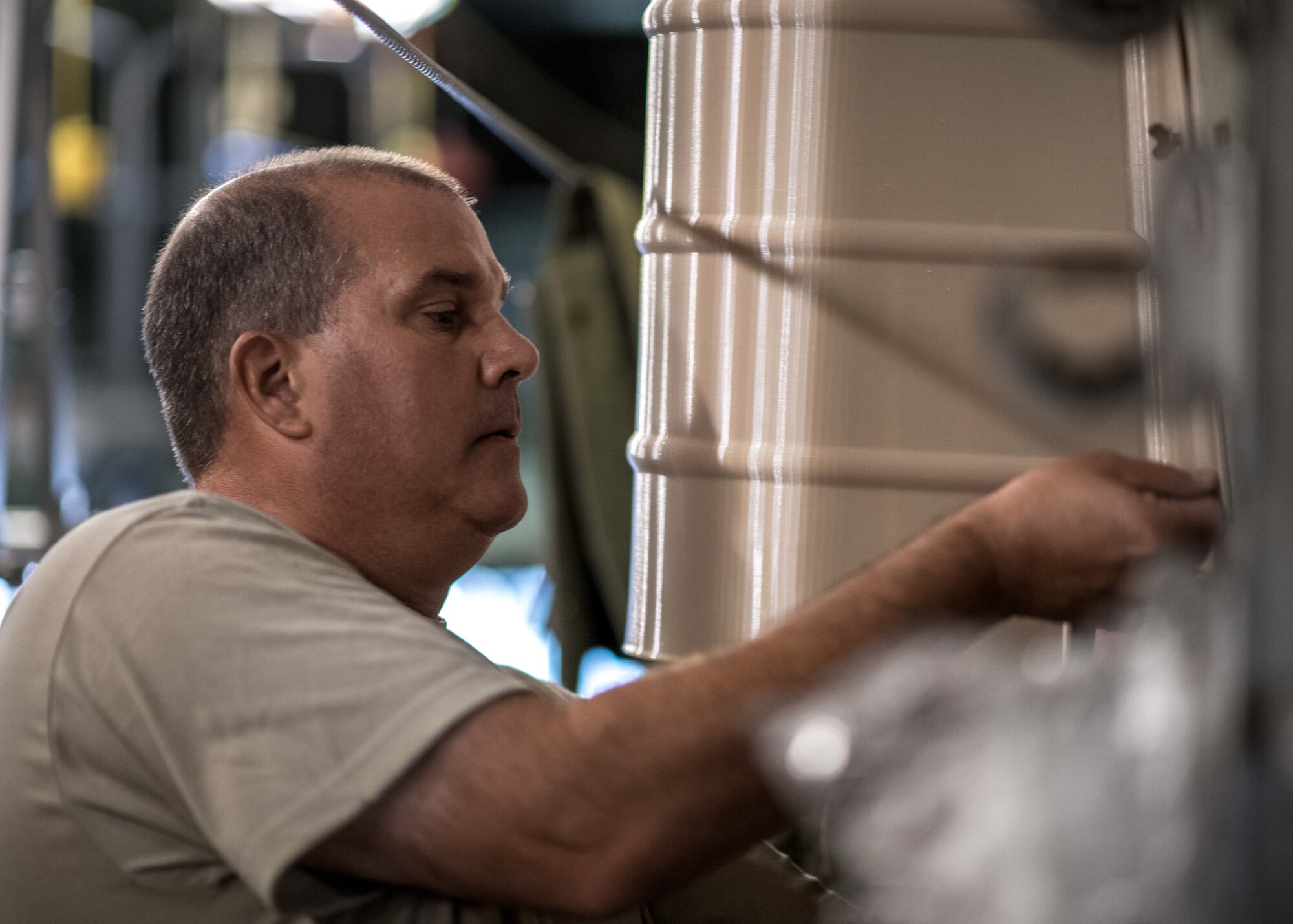 Master Sgt. Scott Obermiyer, aircraft structure maintenance craftsman assigned to the 910th Maintenance Squadron, installs the first Advanced Additive Manufacturing part to be fitted on a C-130H Hercules aircraft, Aug. 5, 2019.