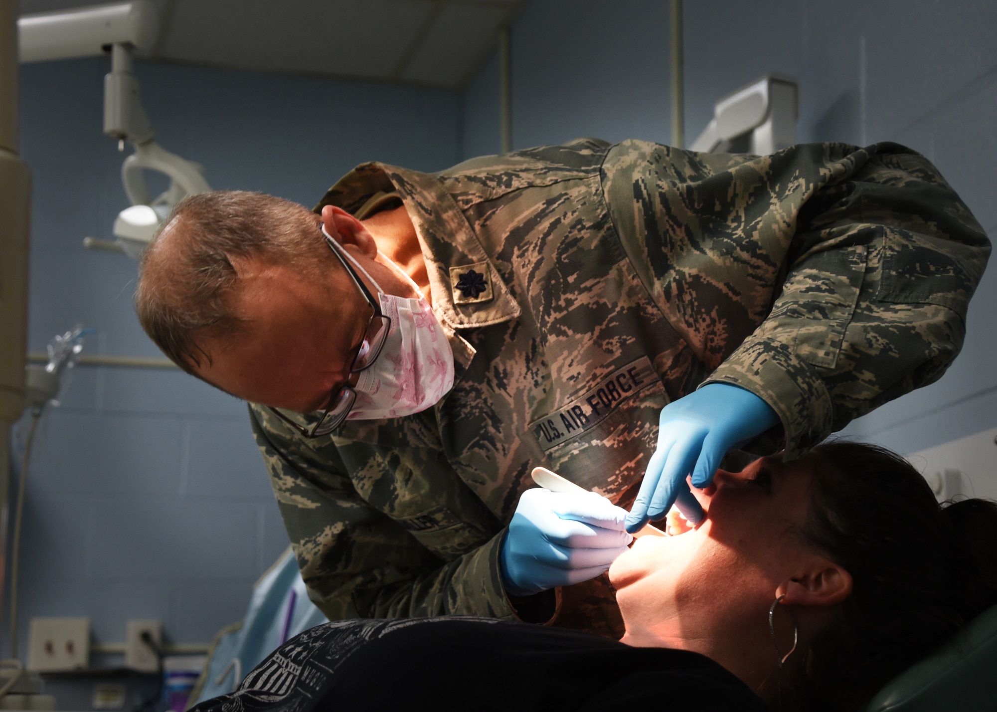 U.S. Air National Guard Lt. Col. Timothy Stuhlmiller, 179th Airlift Wing Medical Group, Mansfield, Ohio, provides a dental examination as part of GuardCare Weekend at the Buckeye Career Center, New Philadelphia, Ohio, Aug. 10, 2019. GuardCare offers the opportunity for community members to receive basic health care and advice. (U.S. Air National Guard photo by Senior Airman Gwendalyn Smith)