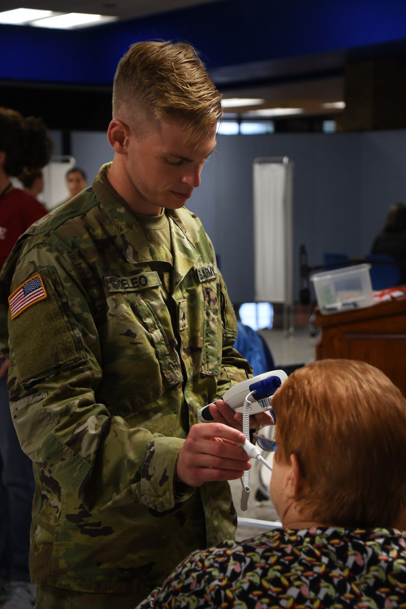A soldier from the Ohio Army National Guard takes a patients vitals as part of GuardCare Weekend Aug. 10, 2019, at the Buckeye Career Center, New Philadelphia, Ohio. During the event both service members from the Ohio Army and Air National Guard provided health services to the local and surrounding New Philadelphia population. (U.S. Air National Guard photo by Senior Airman Gwendalyn Smith)