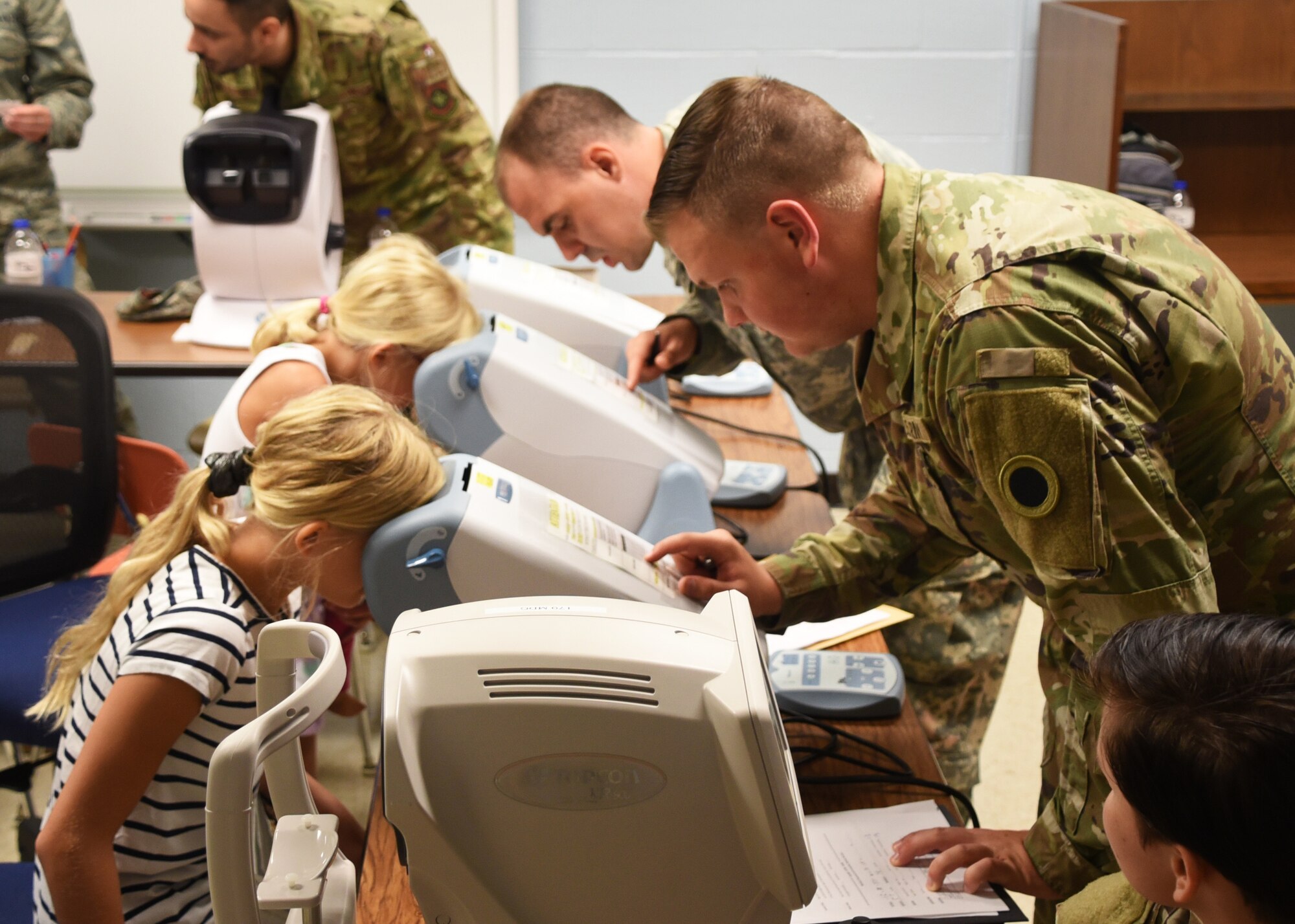 U.S. Air National Guard Lt. Col. Timothy Stuhlmiller, 179th Airlift Wing Medical Group, Mansfield, Ohio, provides a dental examination as part of GuardCare Weekend at the Buckeye Career Center, New Philadelphia, Ohio, Aug. 10, 2019. GuardCare offers the opportunity for community members to receive basic health care and advice. (U.S. Air National Guard photo by Senior Airman Gwendalyn Smith)