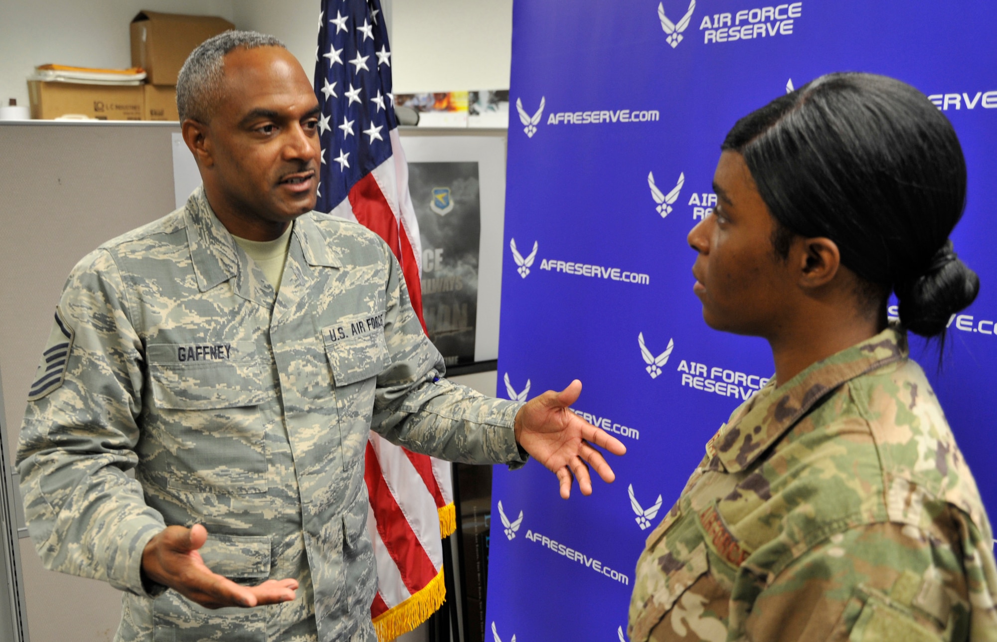 Master Sgt. David Gaffney, 403rd Wing recruiter, explains the Air Reserve Technician application process with Senior Airman Andrea Bradley, 403rd Logistics Readiness Squadron decentralized material support supply technician, during the Unit Training Assembly at Keesler Air Force Base, Biloxi, Mississippi, Aug. 3, 2019. Gaffney assists service members applying for full time ART positions within the 403rd Wing. (U.S. Air Force photo by Tech. Sgt. Michael Farrar)