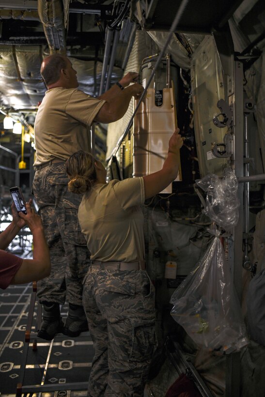 Master Sgt. Scott Obermiyer, aircraft structure maintenance craftsman, and Senior Airman Sabrina Baechel, aircraft structural maintenance helper, both assigned to the 910th Maintenance Squadron, install the first Advanced Additive Manufacturing part to be fitted on a C-130H Hercules aircraft, Aug. 5, 2019, on one of Youngstown Air Reserve Station’s C-130s. The part installed was a utility hydraulic panel, a high-wear, low-risk, non-flight essential part with a high replacement demand within the Air Force’s C-130 fleets.