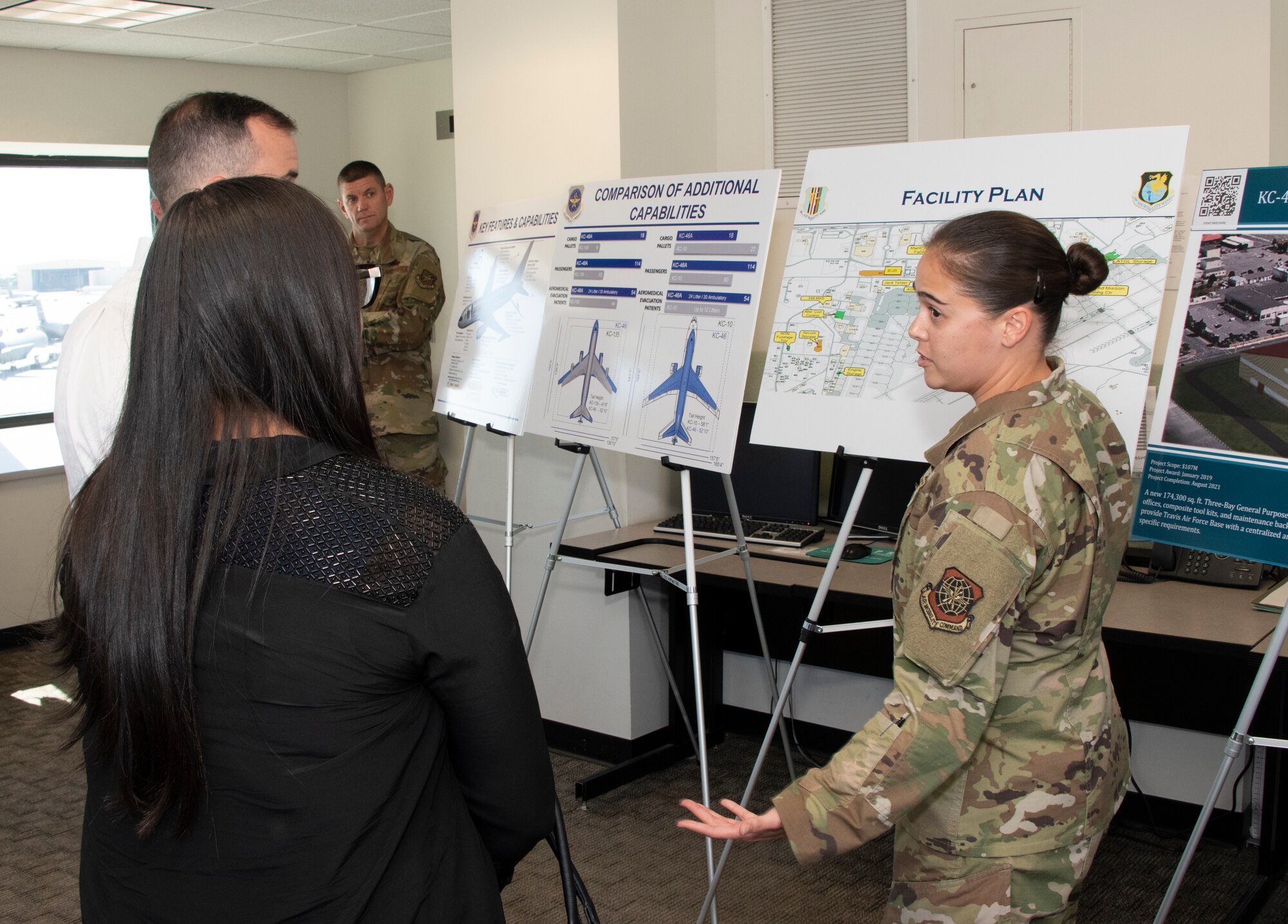 U.S. Air Force Capt. Denise Poole, 60th Operations Support Squadron airfield operations flight commander, discusses airfield operations projects during a tour Aug. 13, 2019, at the control tower, Travis Air Force Base, California.  Representatives for California Senators Diane Feinstein and Kamala Harris visited Travis AFB to gain better knowledge of the mission and discuss the strategic importance of the base. (U.S. Air Force photo by Heide Couch)