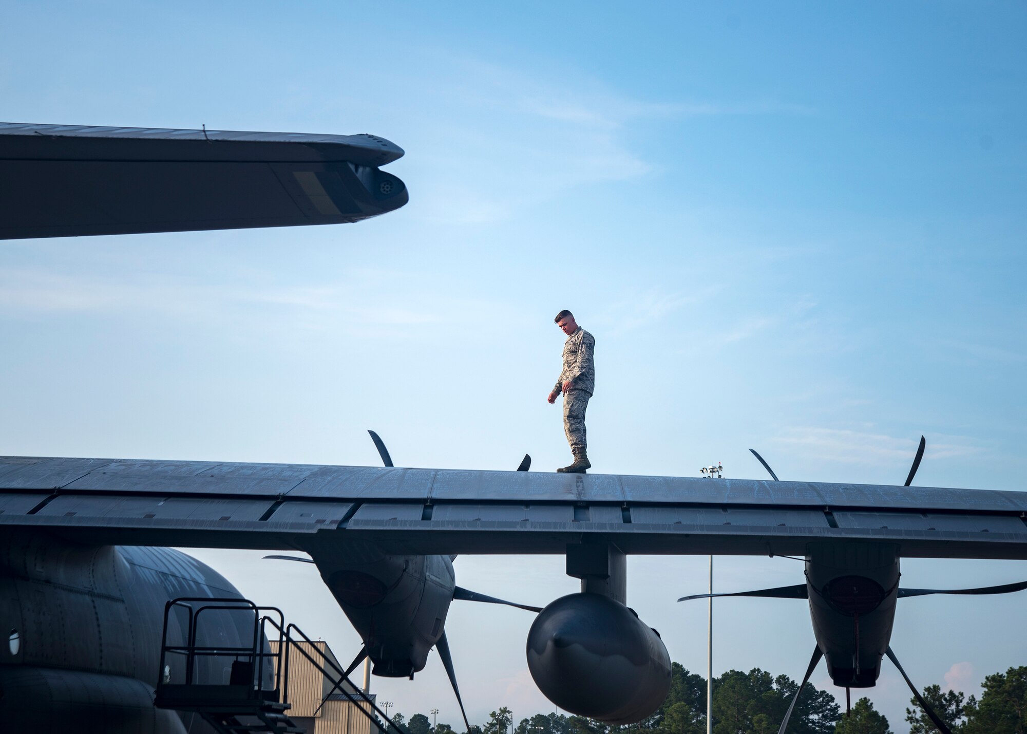 An Airman from the 71st Aircraft Maintenance Unit (AMU) inspects the tail rotor of an HC-130J Combat King II, Aug. 13, 2019, at Moody Air Force Base, Ga. Airmen from the 71st AMU perform various tasks prior to takeoff to ensure the aircraft is performing optimally to complete its mission of supporting the 71st Rescue Squadron. Those tasks consist of: pre-flight inspection, removing plugs and cover, repairing any problems found during crew pre-flight checks as well as marshaling the aircraft for takeoff. (U.S. Air Force photo by Airman 1st Class Eugene Oliver)