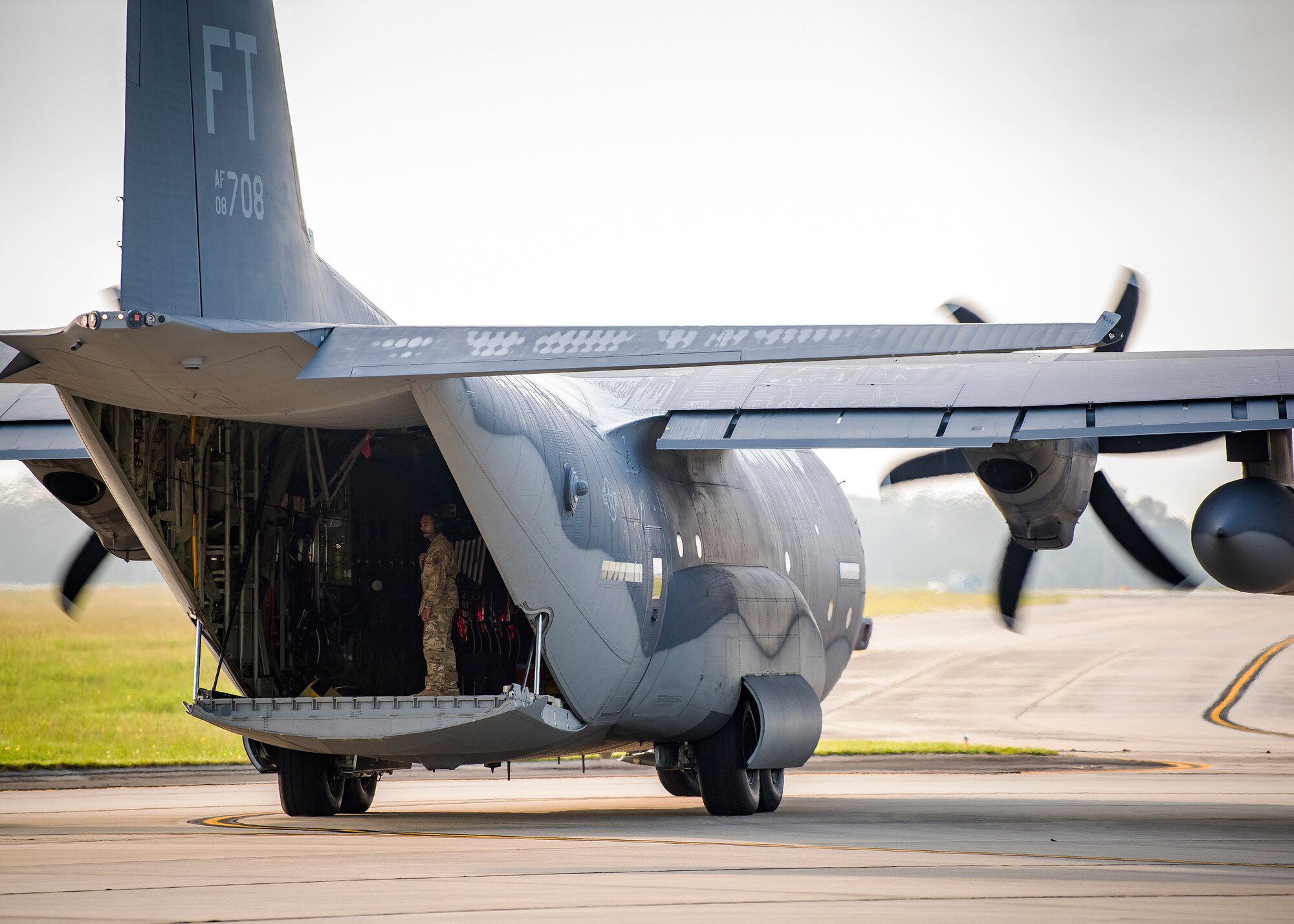An Airman from the 71st Aircraft Maintenance Unit (AMU), inspects an HC-130J Combat King II, Aug. 13, 2019, at Moody Air Force Base, Ga. Airmen from the 71st AMU perform various tasks prior to take off to ensure the aircraft is performing optimally to complete its mission of supporting the 71st Rescue Squadron. Those tasks consist of: pre-flight inspection, removing plugs and cover, repairing any problems found during crew pre-flight checks as well as marshaling the aircraft for takeoff. (U.S. Air Force photo by Airman 1st Class Eugene Oliver)