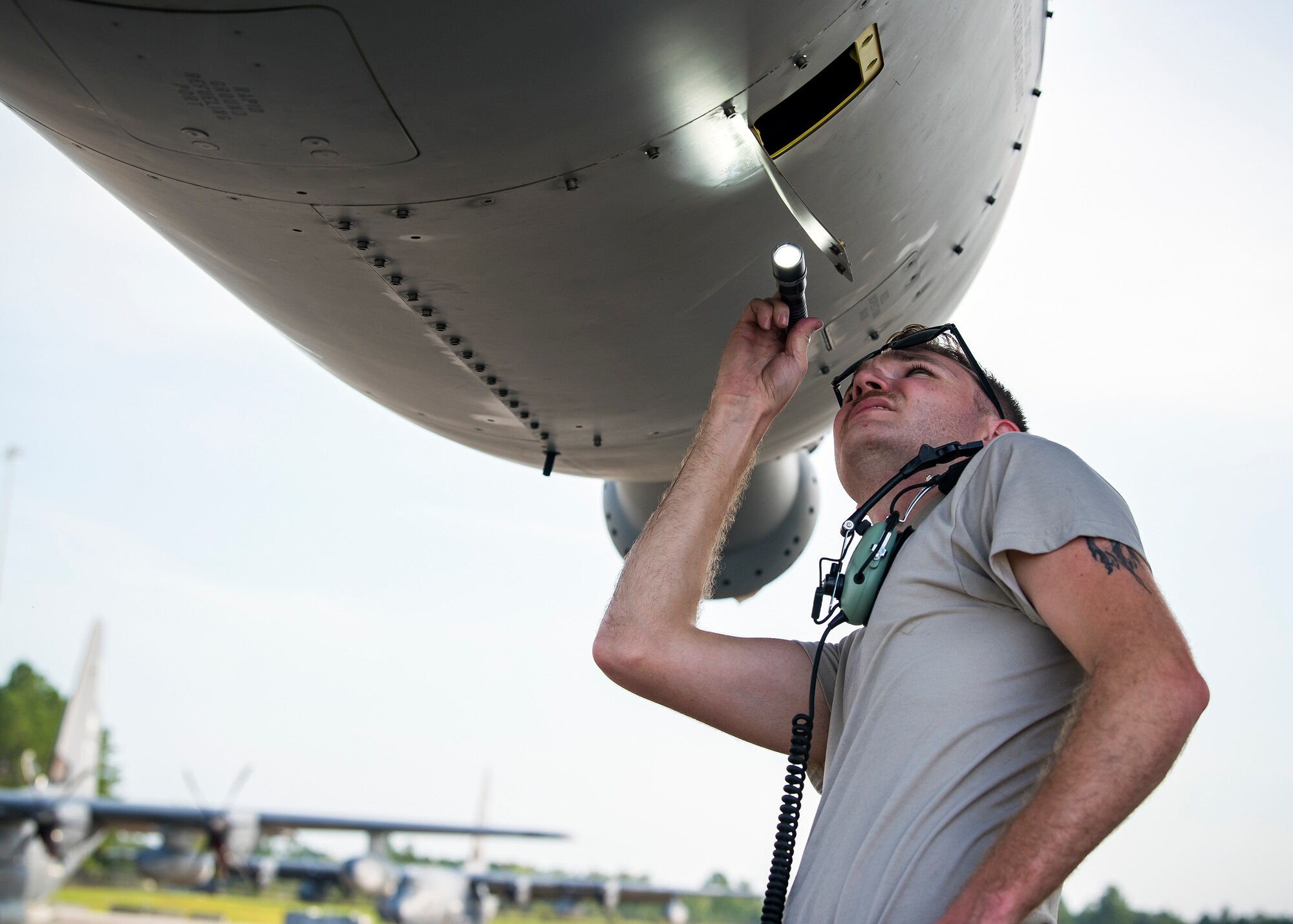 An Airman from the 71st Aircraft Maintenance Unit (AMU), inspects the engine of an HC-130J Combat King II, Aug. 13, 2019, at Moody Air Force Base, Ga. Airmen from the 71st AMU perform various tasks prior to take off to ensure the aircraft is performing optimally to complete its mission of supporting the 71st Rescue Squadron. Those tasks consist of: pre-flight inspection, removing plugs and cover, repairing any problems found during crew pre-flight checks as well as marshaling the aircraft for take-off. (U.S. Air Force photo by Airman 1st Class Eugene Oliver)