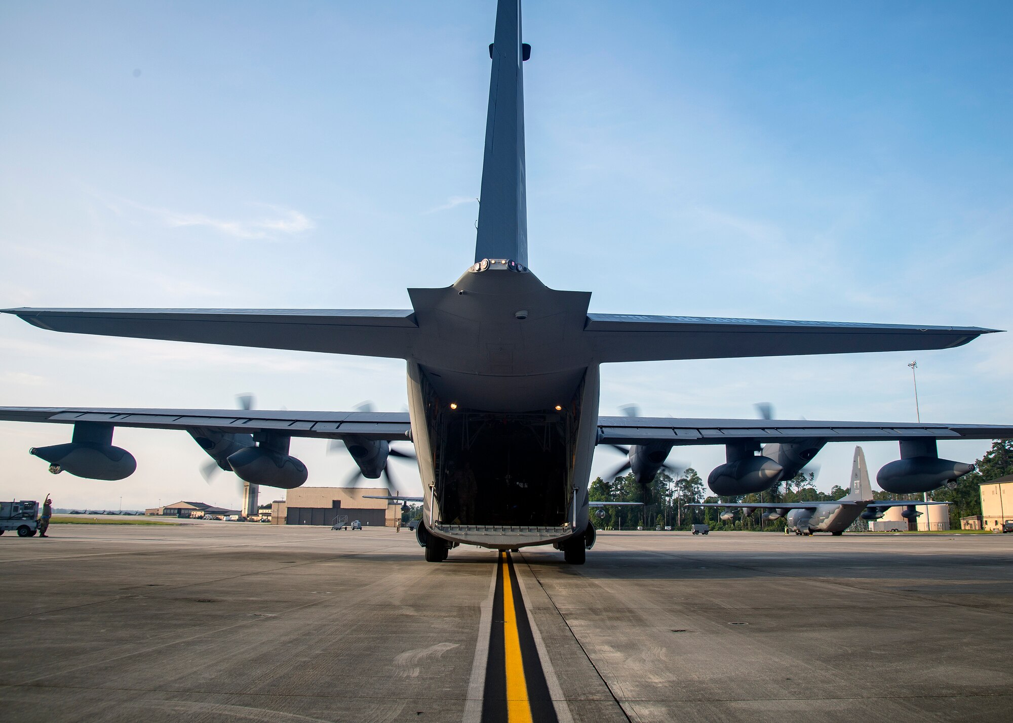 An HC-130J Combat King II sits on the flightline, Aug. 13, 2019, at Moody Air Force Base, Ga. Airmen from the 71st Aircraft Maintenance Unit perform various tasks prior to takeoff to ensure the aircraft is performing optimally to complete its mission of supporting the 71st Rescue Squadron. Those tasks consist of: pre-flight inspection, removing plugs and cover, repairing any problems found during crew pre-flight checks as well as marshaling the aircraft for takeoff.  (U.S. Air Force photo by Airman 1st Class Eugene Oliver)