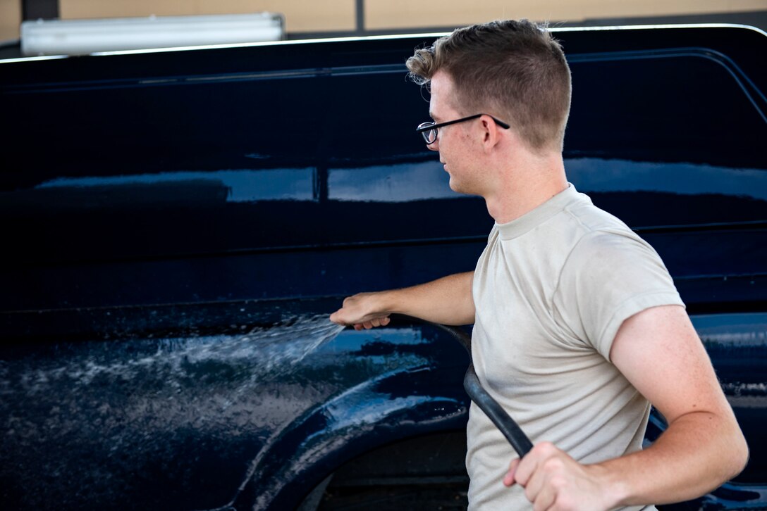 Senior Airman Alex Koch, 23d Logistics Readiness Squadron ground transportation operator, washes a truck after a vehicle inspection, Aug. 12, 2019, at Moody Air Force Base, Ga. The ground transportation flight inspects all of their 56 vehicles weekly to ensure they remain operational, and by performing routine inspections, they’re able to maintain the longevity of their fleet. (U.S. Air Force photo by Senior Airman Erick Requadt)