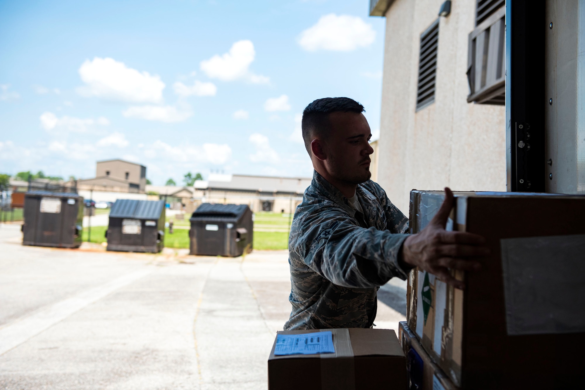 Airman 1st Class Timothy Hankins, 23d Logistics Readiness Squadron documented cargo operator, unloads cargo during a cargo sweep, Aug. 13, 2019, at Moody Air Force Base, Ga. The documented cargo section is responsible for transporting mission-critical equipment and material to squadrons across the base, which helps facilitate mission execution. (U.S. Air Force photo by Senior Airman Erick Requadt)