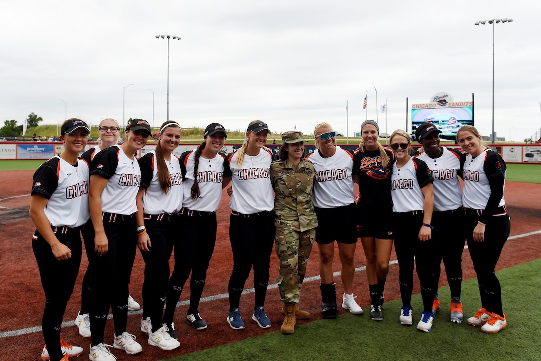Maj. Rebecca Spohr, assigned to the 85th U.S. Army Reserve Support Command, pauses for a photo with the Chicago Bandits softball team, before the Bandits home game vs. the United States Specialty Sports Association Pride team at Parkway Bank Sports Complex, August 11, 2019, in Rosemont, Illinois.