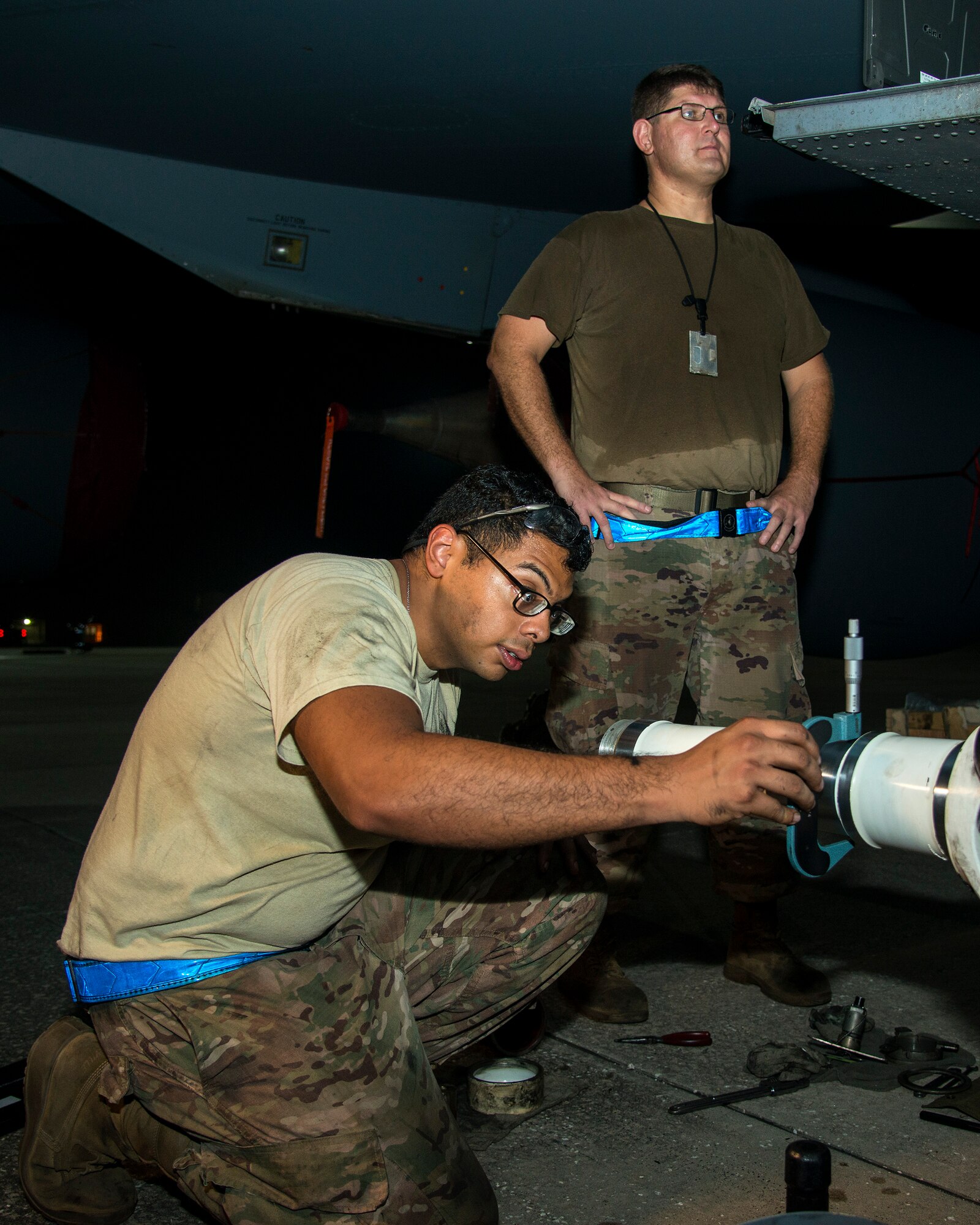 U.S. Air Force Airman 1st Class Lorenzo Hernandez and U.S. Air Force Staff Sgt. Adam Rogers, 6th Aircraft Maintenance Squadron dedicated crew chiefs, inspect a KC-135 Stratotanker brake frame for damage at MacDill Air Force Base, Fla., Aug. 12, 2019.