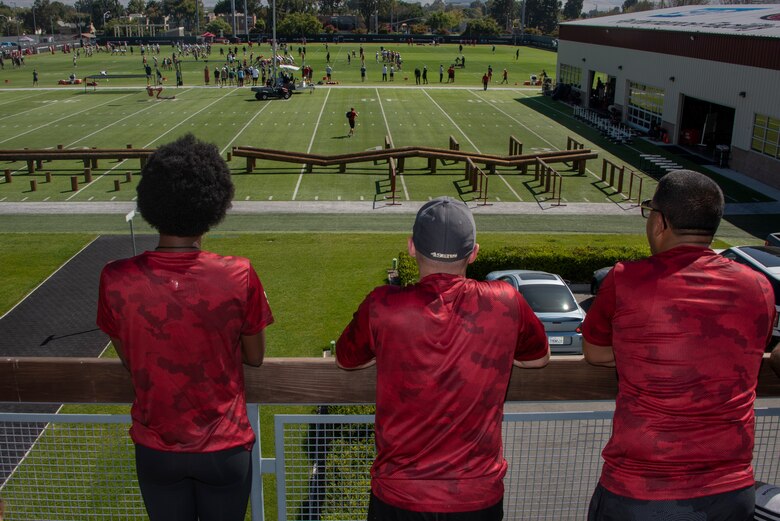 U.S. Airmen from Travis Air Force Base, California, watch as the San Francisco 49ers practice Aug. 13, 2019, during the Salute to Service Boot Camp in Santa Clara, California. Fifty Airmen attended the event from numerous units. The event provided Airmen with an opportunity to interact with NFL players and compete against one another in a variety of athletic drills. (U.S. Air Force photo by Tech. Sgt. James Hodgman)