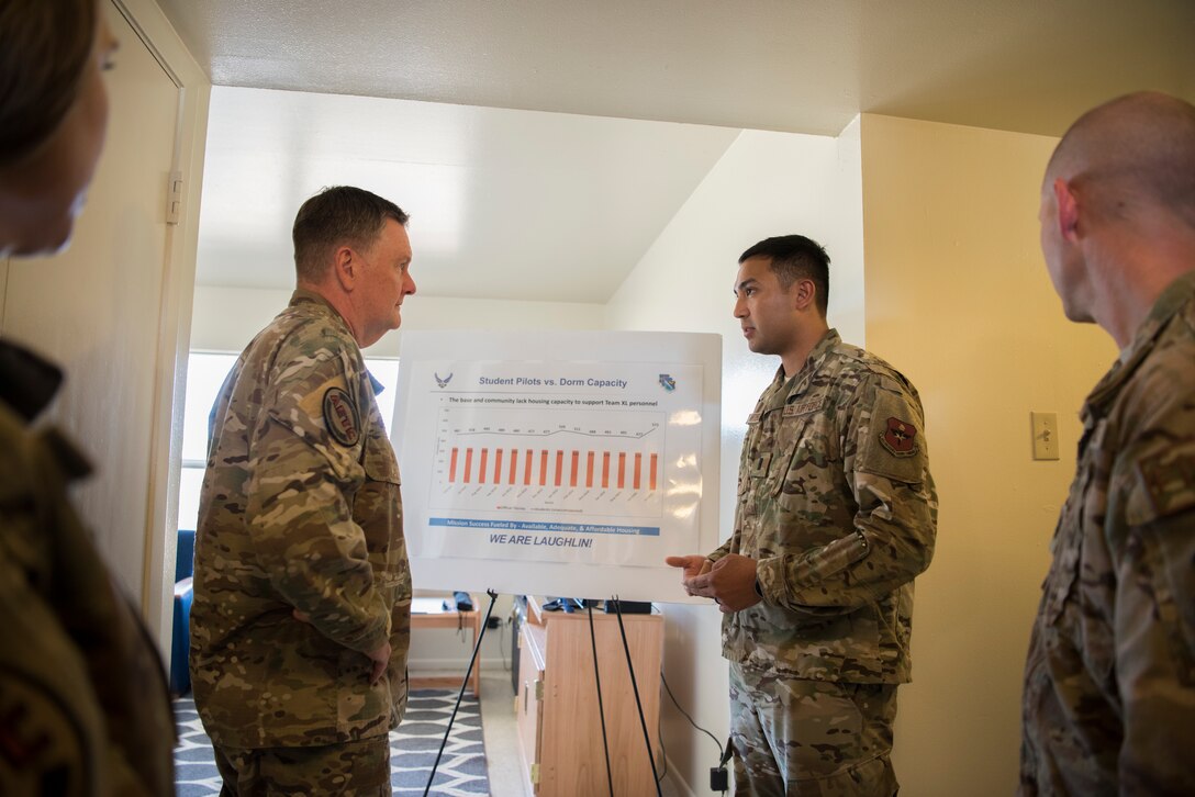 First Lt. Karson Gabriel Artero, 47th Civil Engineer Squadron installation management flight deputy, briefs Lt. Gen. Brad Webb, commander of Air Education and Training Command (AETC), on a current housing problem Laughlin is facing, Aug. 14, 2019, Laughlin Air Force Base, Texas. With plans to boost pilot production, Laughlin is coming up with ways to house all the extra personnel that could be soon be stationed here. (U.S. Air Force photo by Staff Sgt. Benjamin N. Valmoja).