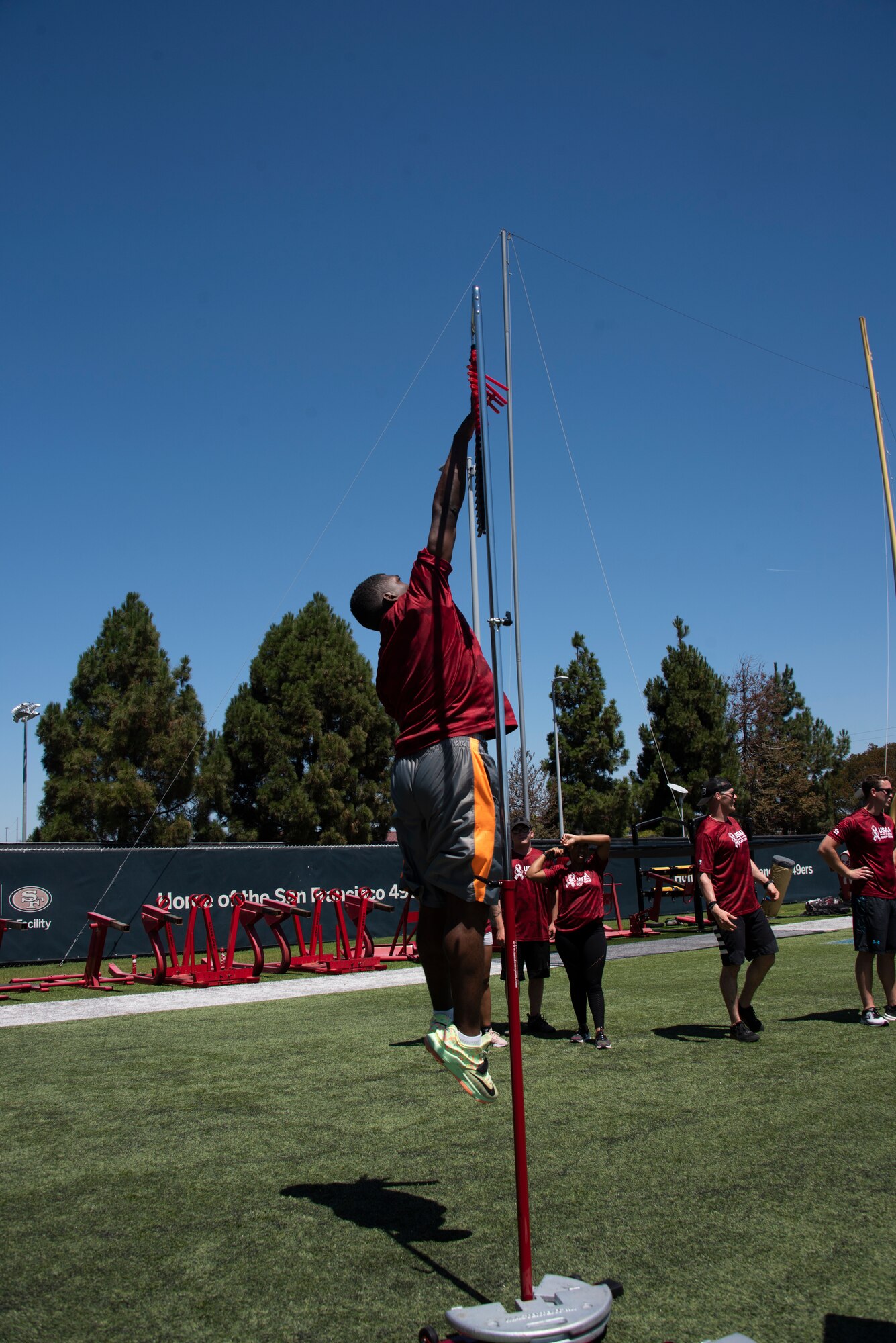 A U.S. Airman from Travis Air Force Base, California, competes in the vertical jump Aug. 13, 2019, during the Salute to Service Boot Camp in Santa Clara, California. The event provided Airmen with an opportunity to interact with NFL players and compete against one another in a variety of athletic drills. (U.S. Air Force photo by Tech. Sgt. James Hodgman)