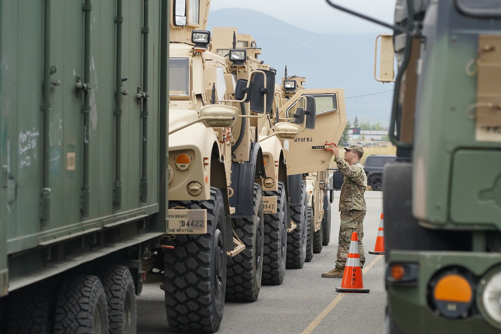 U.S. Army Spc. Cody Dunn, a chemical specialist and native of Cheyenne, WY, assigned to the 4th Infantry Brigade Combat Team. (Airborne), 25th Infantry Division, U.S. Army Alaska, inspects a vehicle for transportation operations on Joint Base Elmendorf-Richardson, Alaska, Aug. 14, 2019, as part of a joint readiness exercise. This exercise allows the Army, Air Force and Navy to move material and personnel using ground, ship, air and rail methods of transportation.