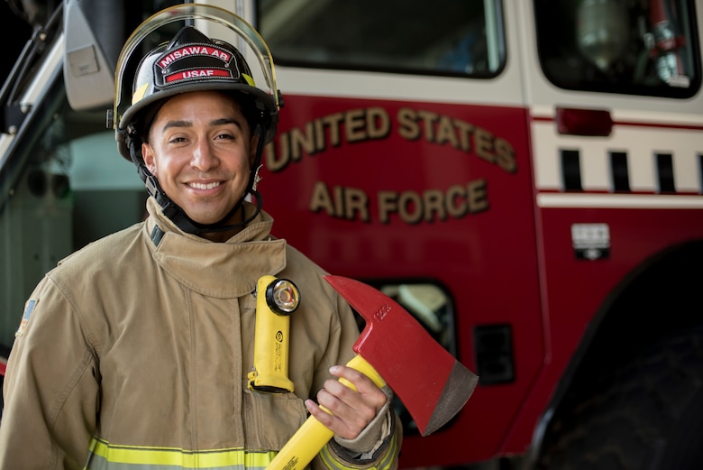 U.S. Air Force Airman 1st Class Adam Cardona, a 35th Civil Engineer Squadron fire protection journeyman, pauses for a photo at Misawa Air Base, Japan, Aug. 7, 2019. The Dallas, Texas, native attended firefighter training for three months prior to receiving orders to his first base, Misawa AB, which resulted in him feeling anxious, but he found solace through the welcoming embrace of local American and Japanese community members. (U.S. Air Force photo by Senior Airman Collette Brooks)