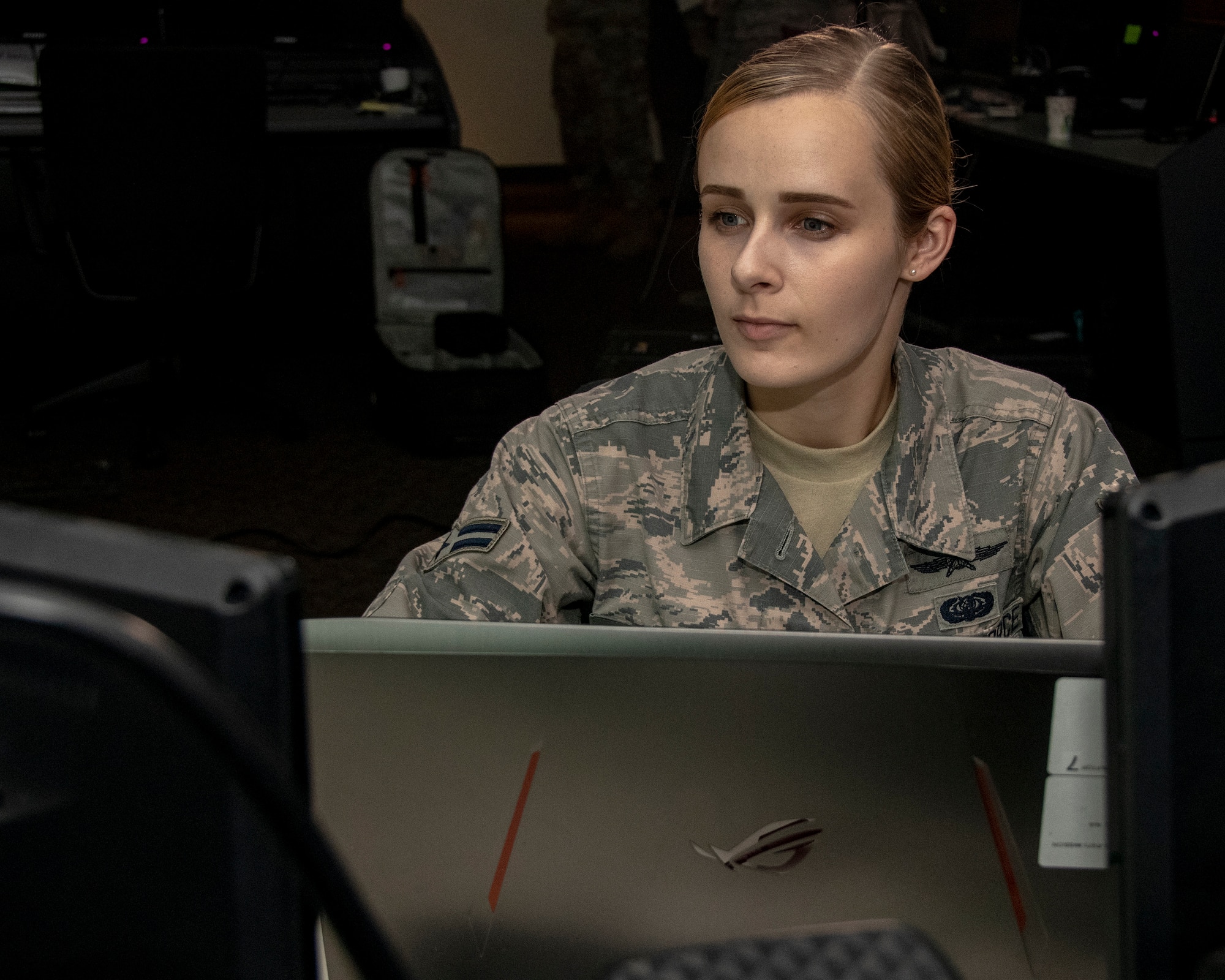 U.S. Air Force Airman 1st Class Kaleigh M. Bevan, a cyberwarfare operator from the 184th Intelligence Wing, Kansas Air National Guard, examines a computer security program in Wichita, Kansas, July 19, 2019. Bevan was recognized as the Air National Guard’s 2019 Outstanding Airman of the Year for her commitment to embracing the Whole Airman Concept in both her personal and professional life. (U.S. Air National Guard photo by Master Sgt. David J. Fenner)
