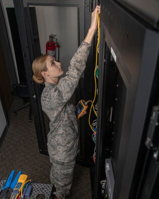 U.S. Air Force Airman 1st Class Kaleigh M. Bevan, a cyberwarfare operator from the 184th Intelligence Wing, Kansas Air National Guard, conducts a systems check in Wichita, Kansas, July 19, 2019. Bevan was recognized as the Air National Guard’s 2019 Outstanding Airman of the Year for her commitment to embracing the Whole Airman Concept in both her personal and professional life. (U.S. Air National Guard photo by Master Sgt. David J. Fenner)
