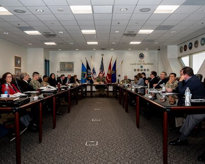 DLA Land and Maritime senior leadership sitting at a large conference table.