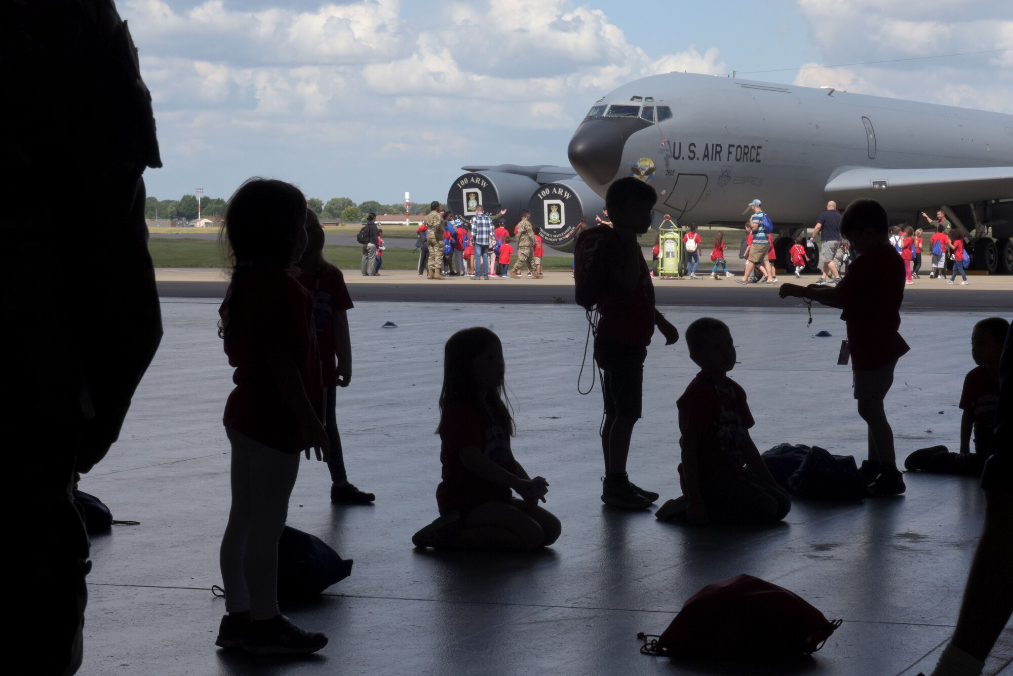 Children wait in line for their turn to tour a KC-135 Stratotanker during the ‘kids deployment line’ at RAF Mildenhall, England, Aug. 9, 2019. The children were able to tour a KC-135 Stratotanker, a CV-22 Osprey and an MC-130J Commando II. (U.S. Air Force photo by Senior Airman Benjamin Cooper)