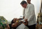 Panamanian President Laurentino Cortizo speaks with a patient.