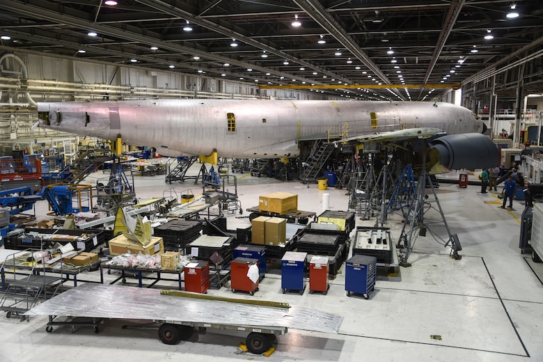 A KC-135R Stratotanker is shown undergoing depot-level maintenance along with parts and supplies (foreground) which were likely acquired through the 448th Supply Chain Management Wing at Tinker Air Force Base, Oklahoma, Sept. 26, 2017. The 448th SCMW let $24.5 million worth of contracts in fiscal year 2017. (U.S. Air Force photo/Greg L. Davis)