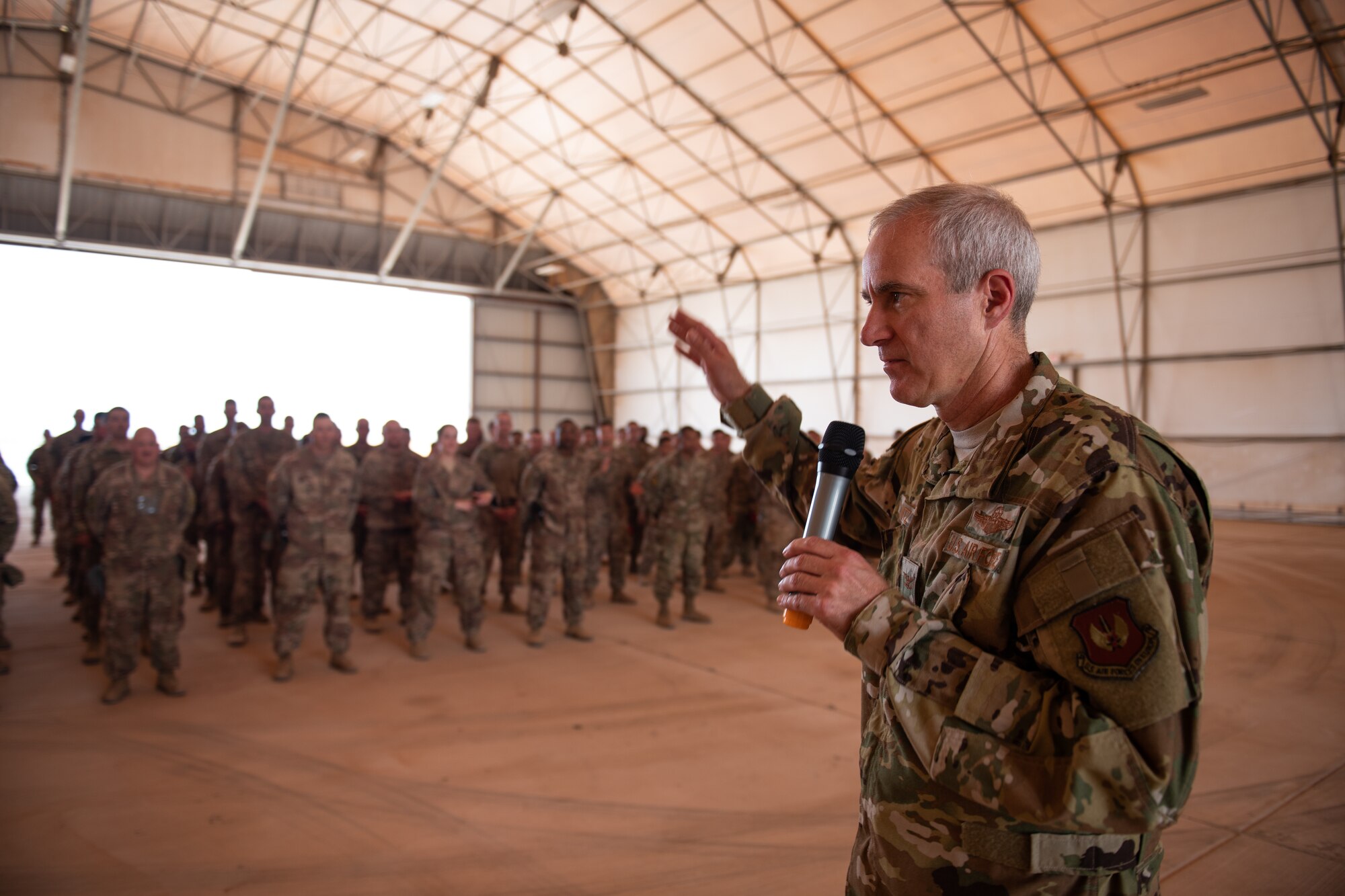 U.S. Air Force Col. Steven J. Jantz, 435th Air Ground Operations Wing and 435th Air Expeditionary Wing commander, speaks to Airmen at Nigerien Air Base 201, Agadez, Niger, Aug. 3, 2019. Jantz spoke about the accomplishments at Air Base 201 and the official opening of the runway. (U.S. Air Force photo by Staff Sgt. Devin Boyer)