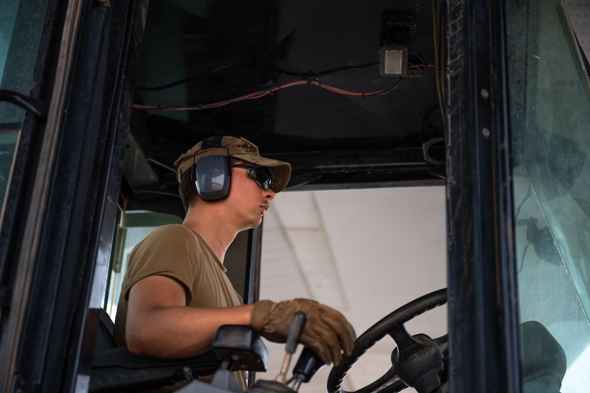 U.S. Air Force Staff Sgt. Dustin Cote, 724th Expeditionary Air Base Squadron air terminal operations center technician, operates a forklift at Nigerien Air Base 201, Agadez, Niger, Aug. 3, 2019. Cote unloaded cargo from the first C-130J Super Hercules to land at Air Base 201, marking the beginning of limited Visual Flight Rules operations at the base. (U.S. Air Force photo by Staff Sgt. Lexie West)
