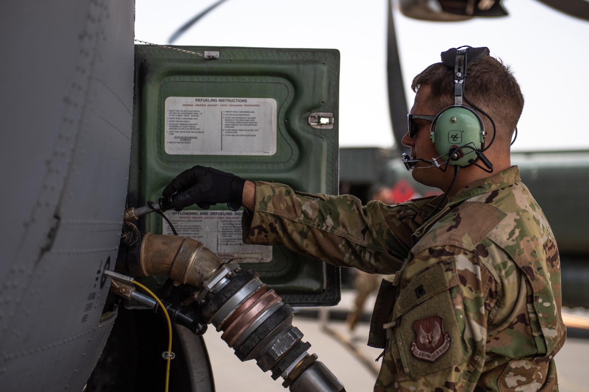 U.S. Air Force Staff Sgt. John Bouscher, 86th Aircraft Maintenance Squadron flying crew chief, refuels a C-130J Super Hercules at Nigerien Air Base 201, Agadez, Niger, Aug. 3, 2019. This was the first C-130 to take-off at Air Base 201, marking the beginning of limited Visual Flight Rules operations at the base. (U.S. Air Force photo by Staff Sgt. Lexie West)