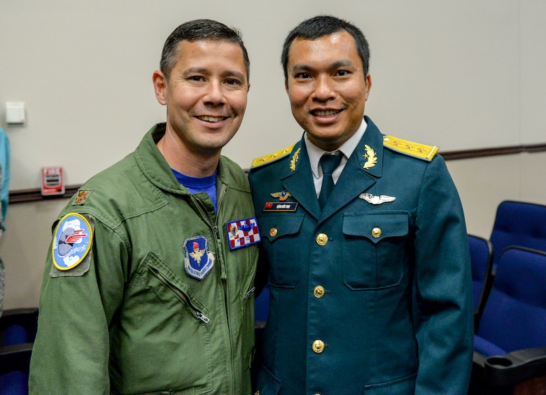 Maj. Dave Cote, 41st Flying Training Squadron instructor pilot and international military student officer, congratulates Capt. Toai Dang, from the Vietnam People’s air force, following a graduation ceremony May 30, 2019, at Columbus Air Force Base, Mississippi. Dang became the first Vietnamese student from Vietnam Air Defense Air Force to graduate the Aviation Leadership Program at Columbus AFB. ALP is a U.S. Air Force-funded program, providing students of friendly and developing countries with undergraduate pilot training scholarships. (U.S. Air Force courtesy photo)