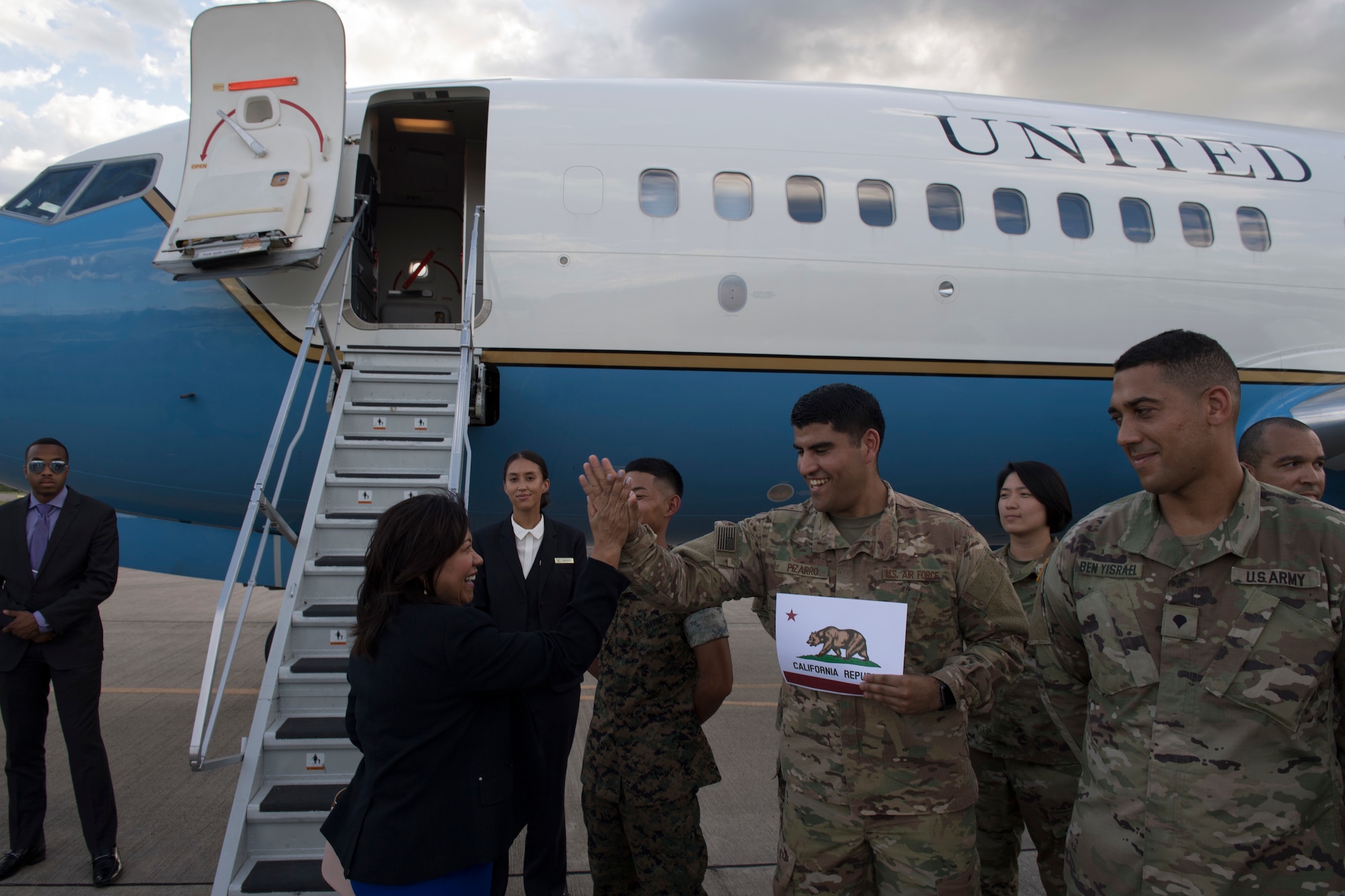 U.S. Air Force Staff Sgt. Christian Pizarro, 612th Air Base Squadron Air Traffic Control watch supervisor, hi-fives Rep. Norma Torres, California 35th district and House Committee on Rules member, during a visit, Aug. 10, 2019, at Soto Cano Air Base, Honduras Representatives from various states visited service members during a visit to Honduras, accompanying the Speaker of the House Nancy Pelosi. (U.S. Air Force photo by Staff Sgt. Eric Summers. Jr.)