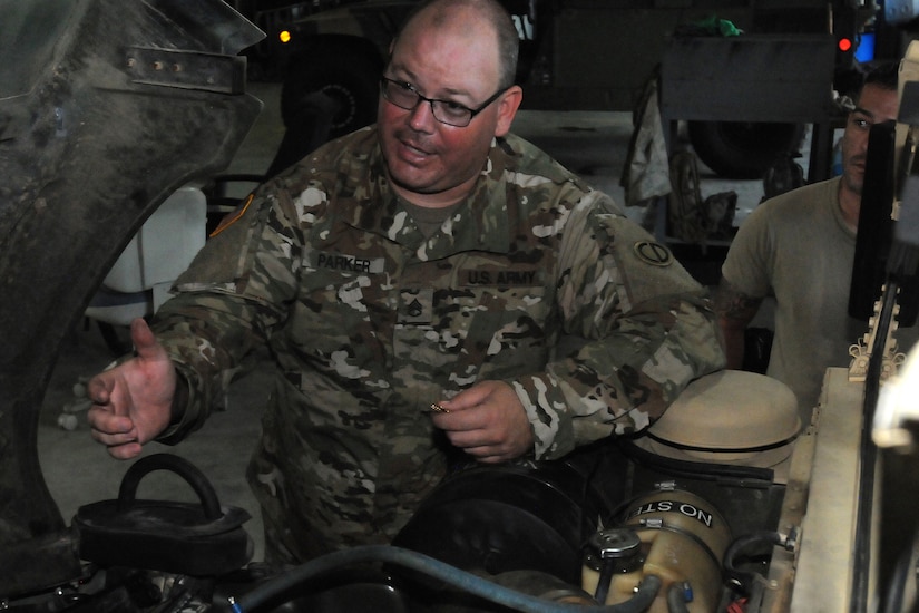 Staff Sgt. Jonathan Parker, lead mechanic, 3-349 Logistic Support Battalion, 85th U.S. Army Reserve Support Command and operationally controlled by First Army’s 177th Armored Brigade, troubleshoots the overheating of an observer coach/trainer Humvee.