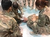 Spc. Taylor M. Nowak, 77th Sustainment Brigade combat medic/health care specialist, U.S. Army Reserve, participates in a medical workshop to help teach the Kuwaiti Land Forces basic life support steps necessary on the battlefield at the Kuwait North Military Medical Complex, July 31, 2019. The workshop uses the U.S. Army Combat Lifesaver Course as the foundation for the training.