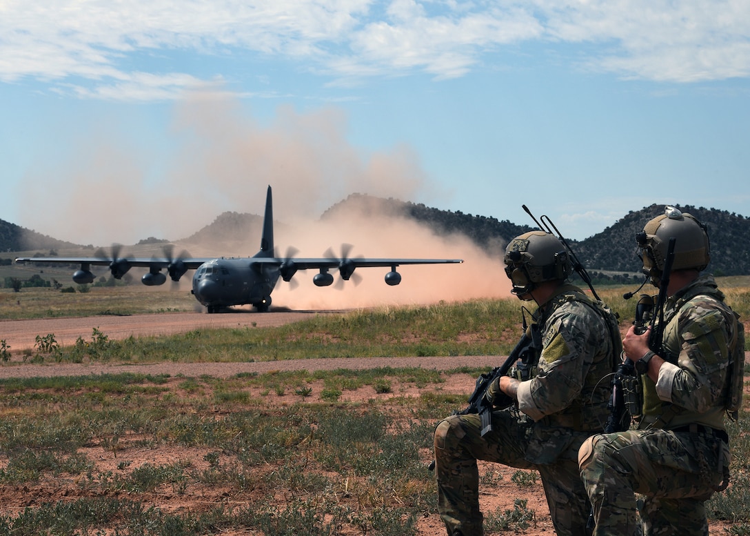 Tactical air control party Airmen from the 13th Air Support Operations Squadron watch a C-130 Hercules from the 302nd Airlift Wing land July 17, 2019 on Fort Carson, Colorado. The 302nd AW helped the 13th ASOS conduct a mission qualification training exercise by using their aircraft as part of their training. (U.S. Air Force photo by Airman 1st Class Andrew Bertain)