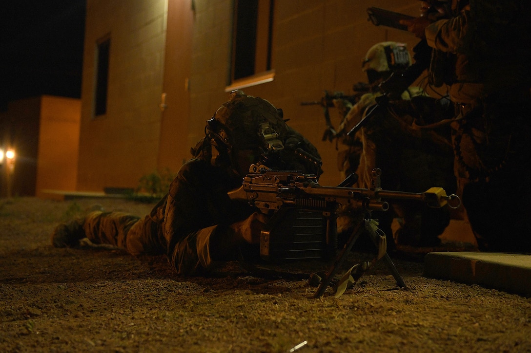 Airmen from the 13th Air Support Operations Squadron secure a village during mission qualification training July 17, 2019 on Fort Carson, Colorado. During the exercise, the team of Airmen were in charge of gaining control of the fake village, while the instructors played as an opposing force.  (U.S. Air Force photo by Airman 1st Class Andrew Bertain)