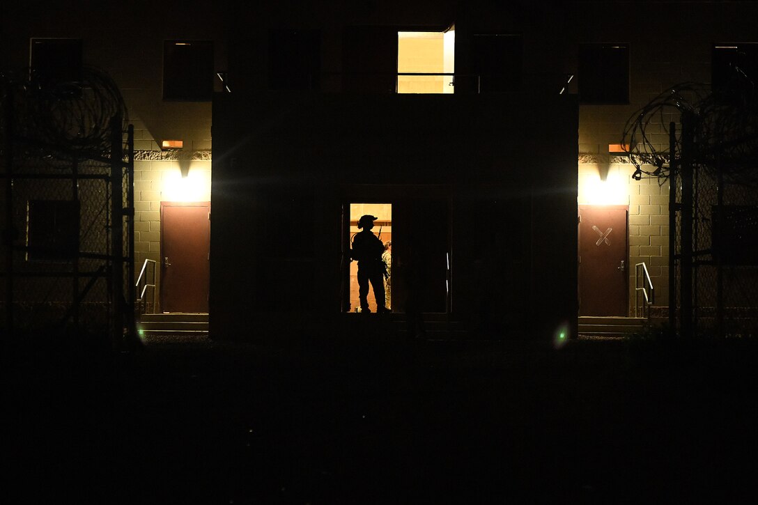 An Airman from the 13th Air Support Operations Squadron waits during a pause in the exercise July 17, 2019 on Fort Carson, Colorado. During the tactical air control party mission qualification training exercise, Airmen participated in securing a village, injured personnel rescue and handling a hostage scenario. The PAUSE-EX was put in place so the instructors could set up in transition between securing the village and the hostage scenario. (U.S. Air Force photo by Airman 1st Class Andrew Bertain)