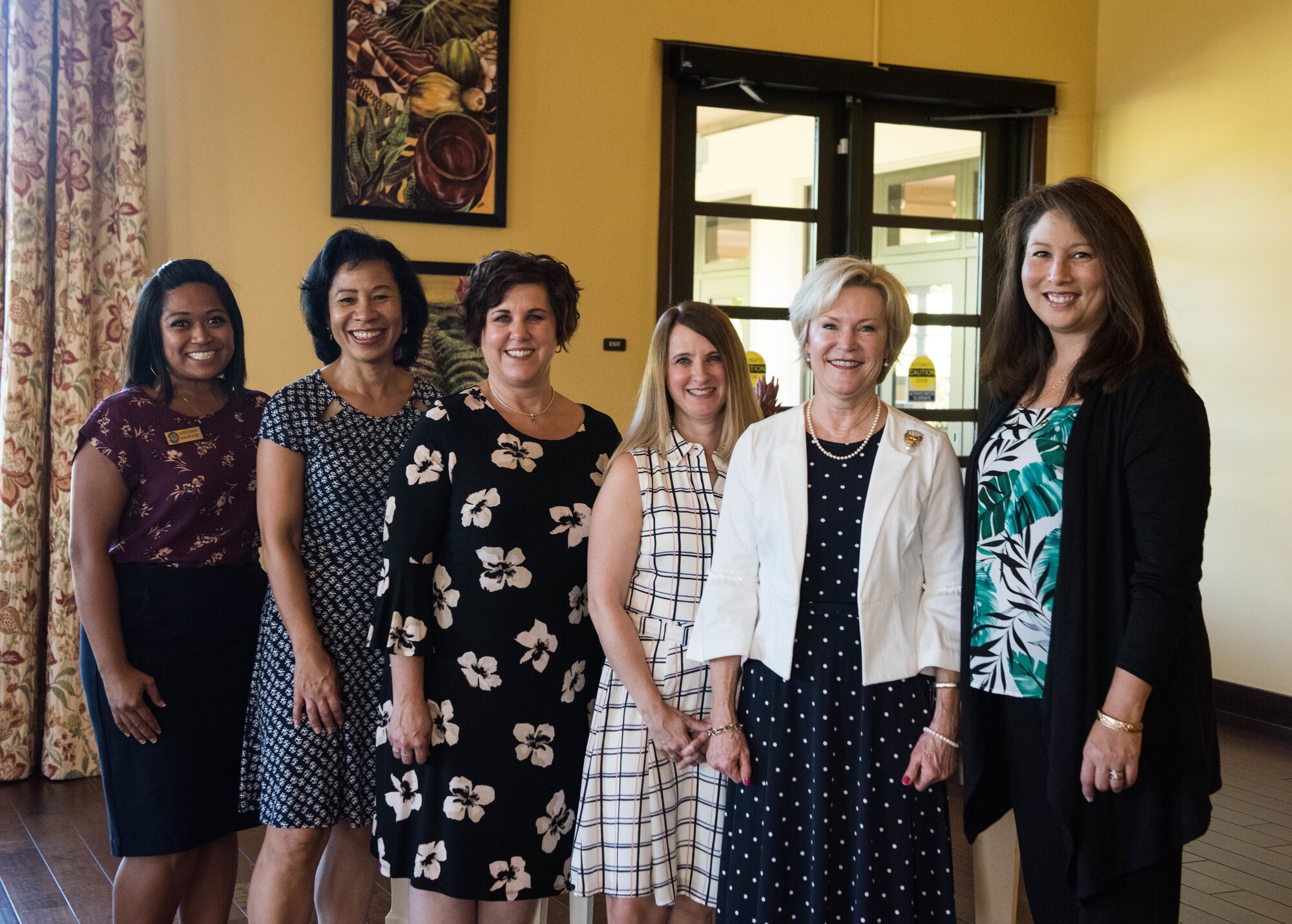 Dawn Goldfein (second from right), wife of Air Force Chief of Staff, Gen. David L. Goldfein, takes a photo with Hickam Community staff and spouses during a visit to the Ka Makani Community Center on Joint Base Pearl Harbor-Hickam, Hawaii, August 14, 2019. Goldfein also toured a house on the historic housing registry and the Child Development Center on base. (U.S. Air Force photo by Staff Sgt. Hailey Haux)