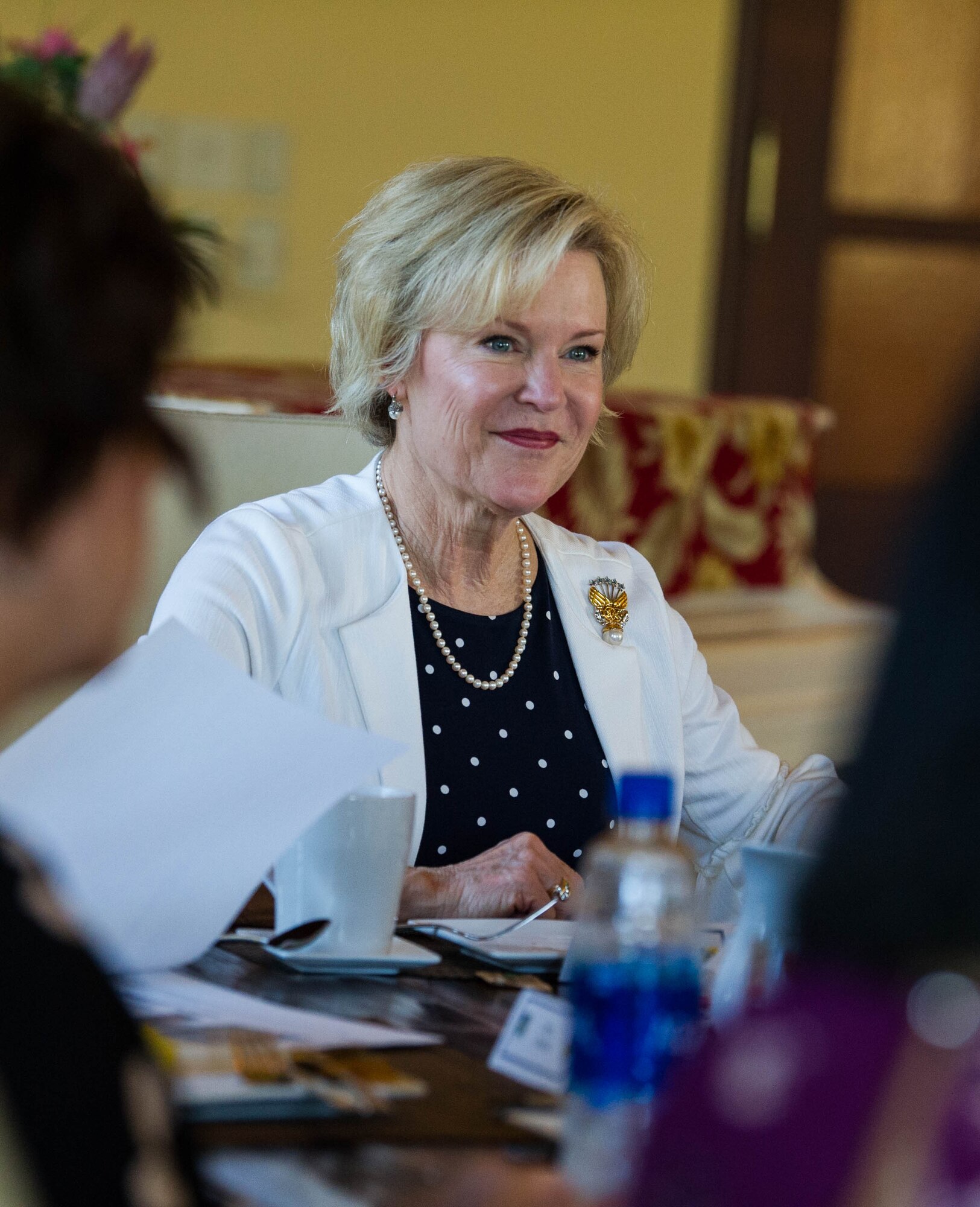 Dawn Goldfein, wife of Air Force Chief of Staff, Gen. David L. Goldfein, discusses on base housing with the Hickam Communities Project Director, other staff members and spouses during her visit to Joint Base Pearl Harbor-Hickam, Hawaii, August 14, 2019. Goldfein also toured a house on the historic housing registry and the Child Development Center on base. (U.S. Air Force photo by Staff Sgt. Hailey Haux)