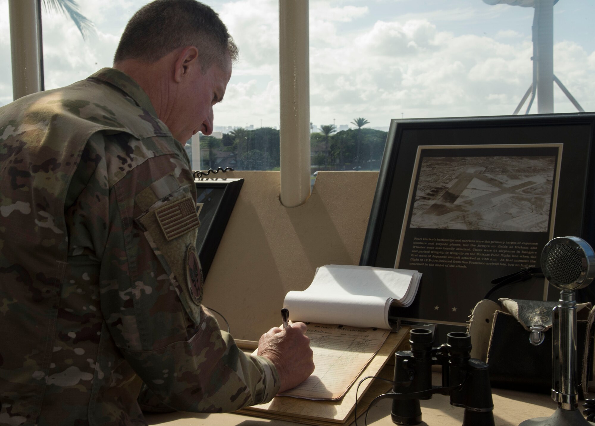 Air Force Chief of Staff Gen. David L. Goldfein signs the visitors log in the Historic Base Operations building, at Joint Base Pearl Harbor-Hickam, Hawaii, Aug. 14, 2019. During the Japanese attack on Dec. 7, 1941, the airfield managers worked from the Base Operations Building to limit casualties and damages to the aircraft fleet. This was Goldfein’s first stop as he visits various units in the Indo-Pacific. (U.S. Air Force photo by Tech. Sgt. Heather Redman)