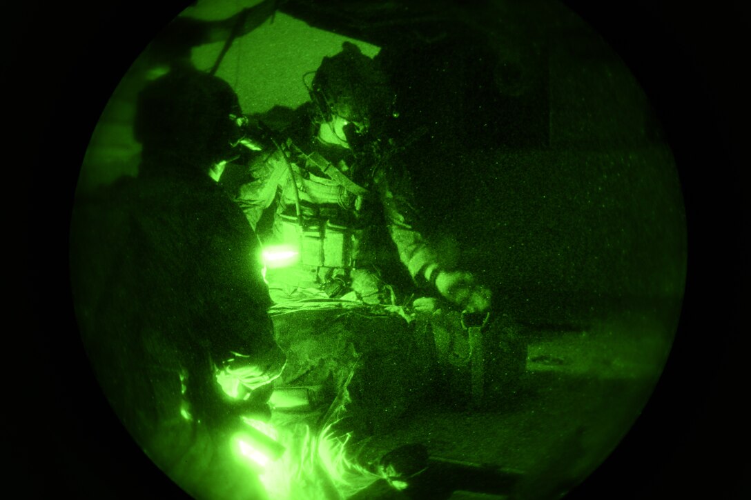 Airmen from the 13th Air Support Operations Squadron go through a personnel rescue during mission qualification training July 17, 2019 on Fort Carson, Colorado. The rescue mission scenario had the group of Airmen retrieve someone from a downed helicopter and perform basic first aid, all while under opposing fire.  (U.S. Air Force photo by Airman 1st Class Andrew Bertain)