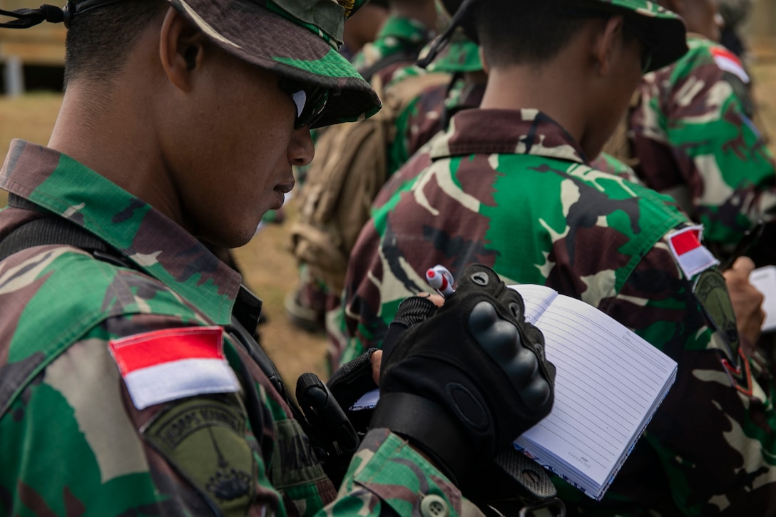 An Indonesian Marine takes notes, Marine Corps Base Hawaii, (MCBH) Aug. 7, 2019. U.S. and Indonesian Marines conducted bilateral training on MCBH in order to learn from each other and continue to improve their abilities as a team. (U.S. Marine Corps photo by Pfc. Jose Angeles)