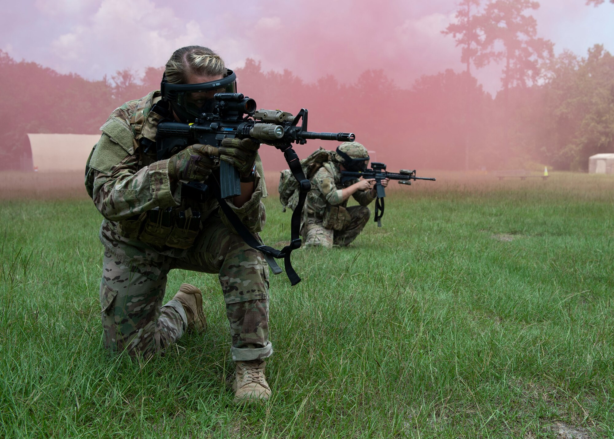 Staff Sgt. Miranda Roberts, 824th Base Defense Squadron fire team leader, aims down her sight during the Tactical Leaders Course, Aug. 10, 2019, at Moody Air Force Base, Ga. The 7-day course revolved around squad leaders developing their skills to effectively communicate, team build and mission plan. These skills were assessed during a 36-hour simulated operation where squad leaders lead Airmen through tactical situations. (U.S. Air Force photo by Airman Azaria E. Foster)